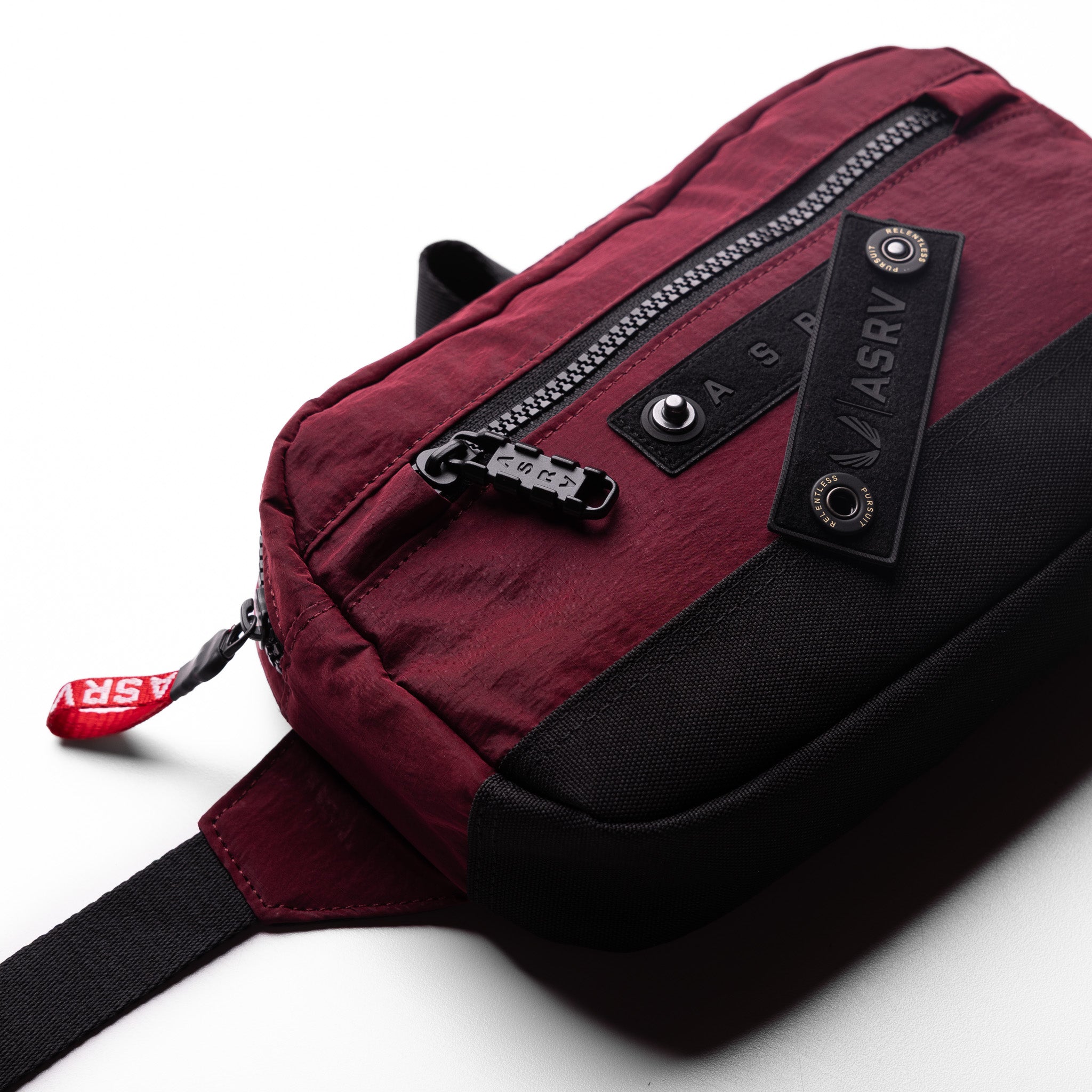 Flatlay 1231 Ripstop Crossbody Bag in Crimson, angled view