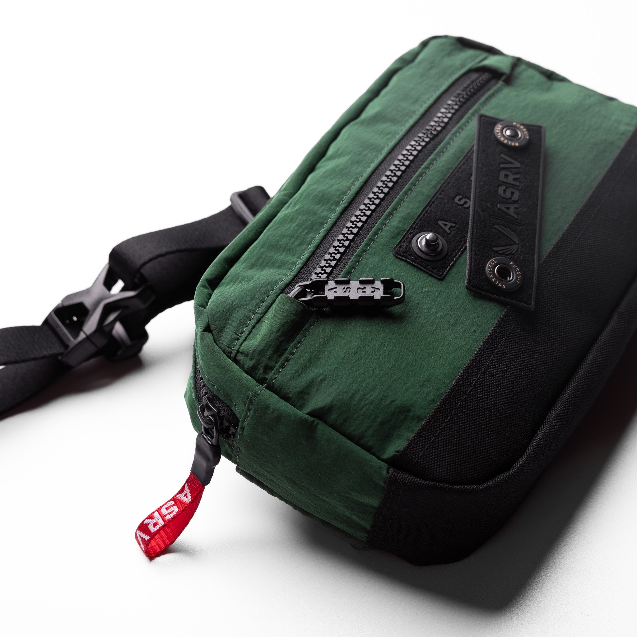 1231. Ripstop Crossbody Bag in forest green, worn with shoulder strap visible
