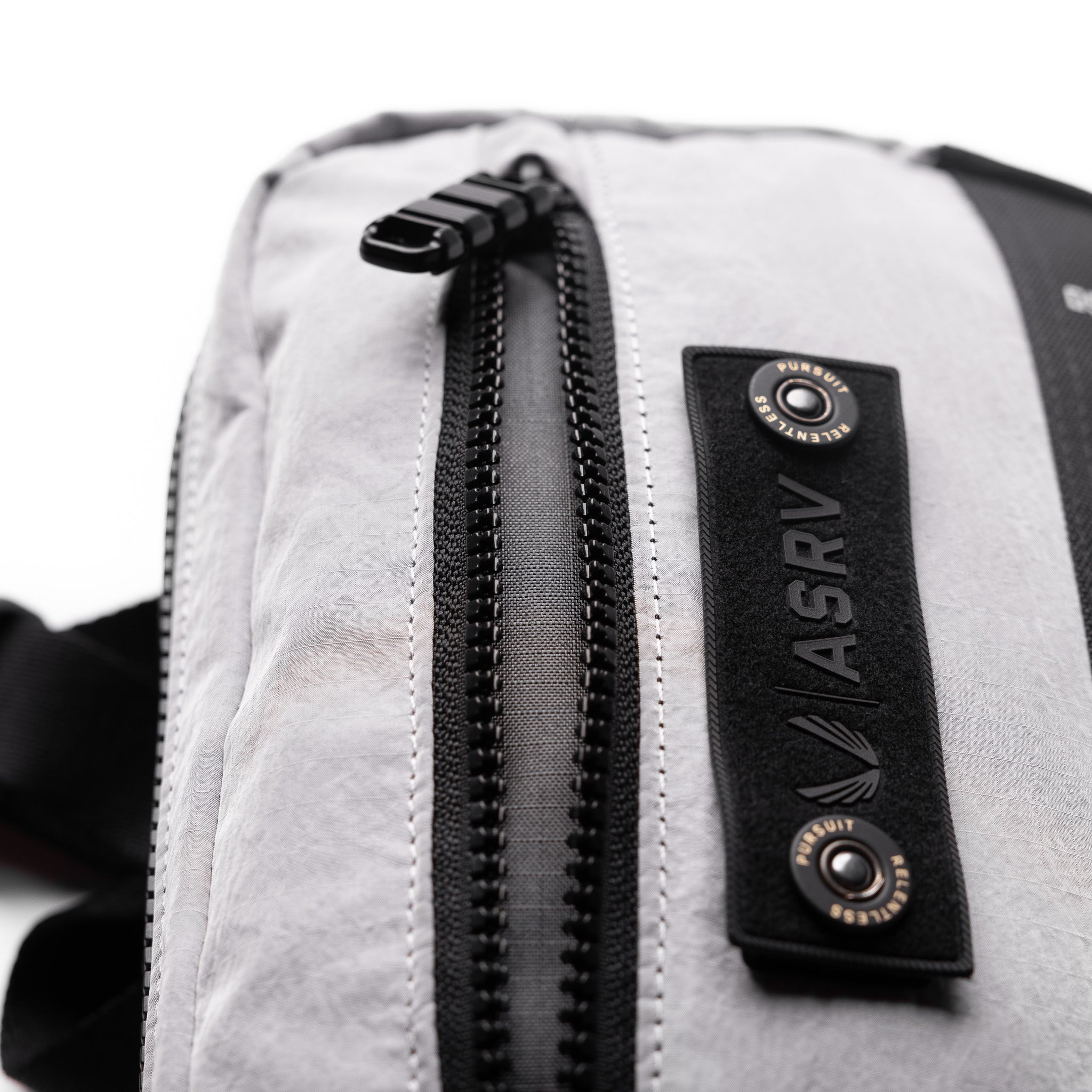 1231 Ripstop Crossbody Bag in Slate Grey, detail closeup of zipper and label