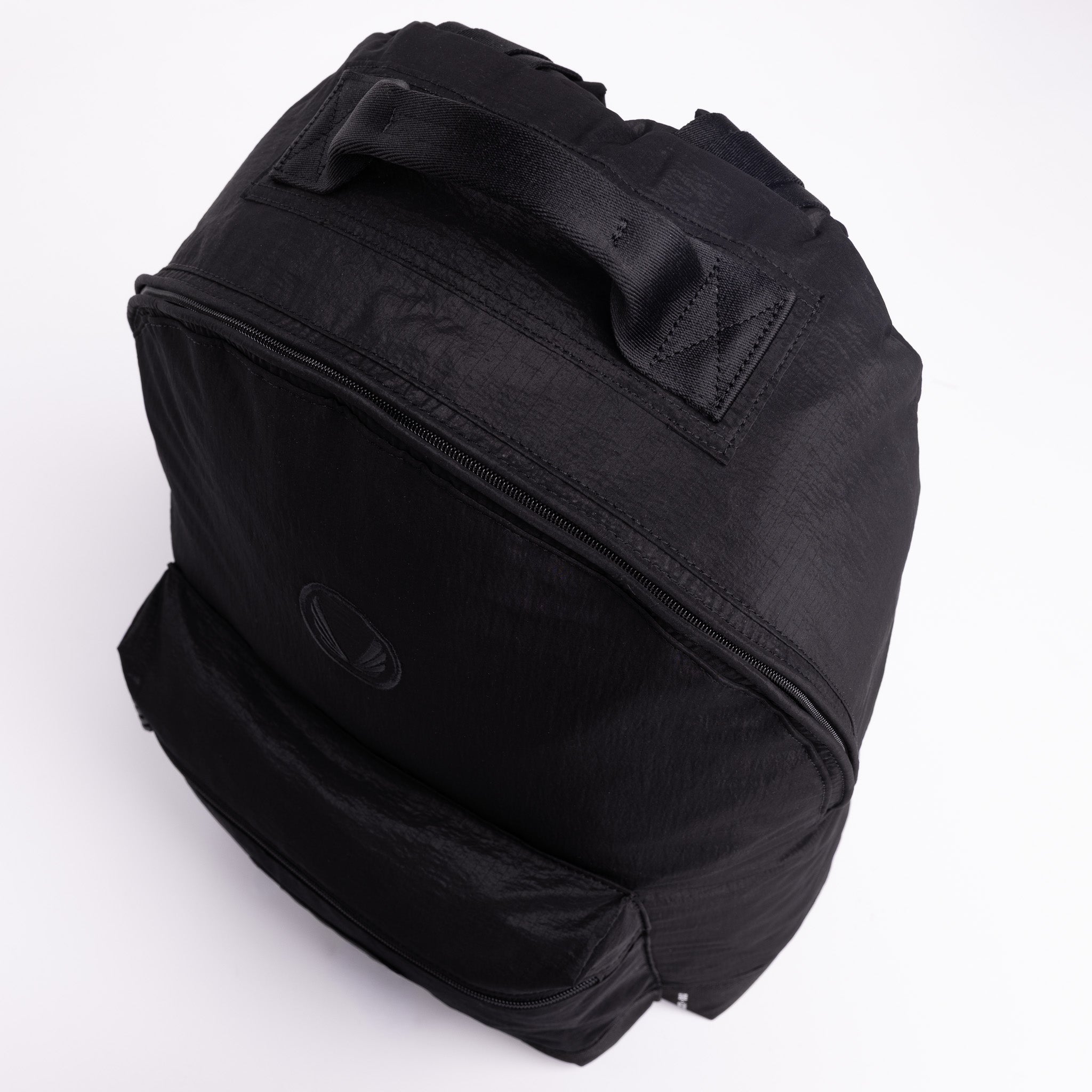 Flatlay 1233 Ripstop Backpack in black, angled front view