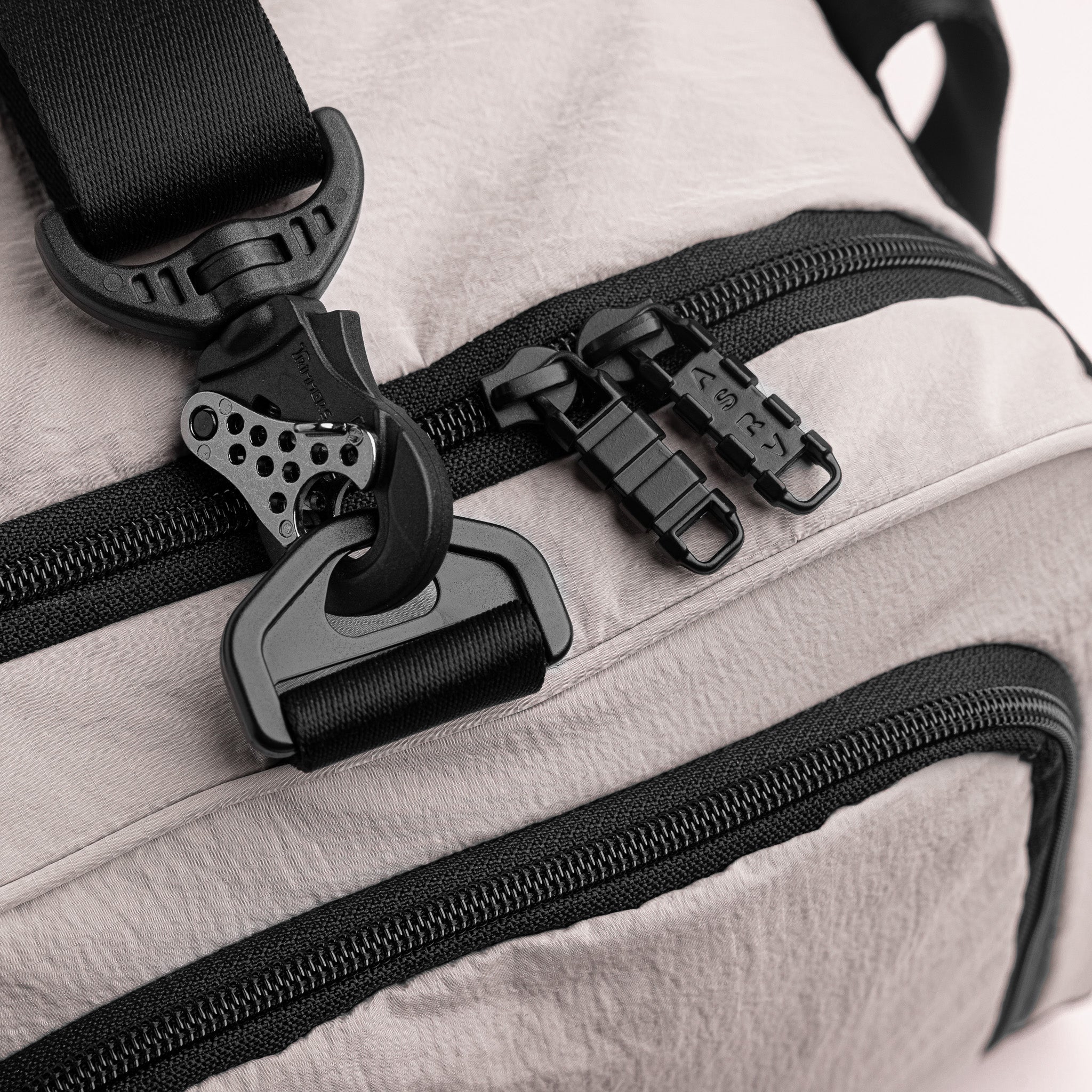 Flatlay 1234 Ripstop Duffle Bag in Chai, detail view of zippers and hardware