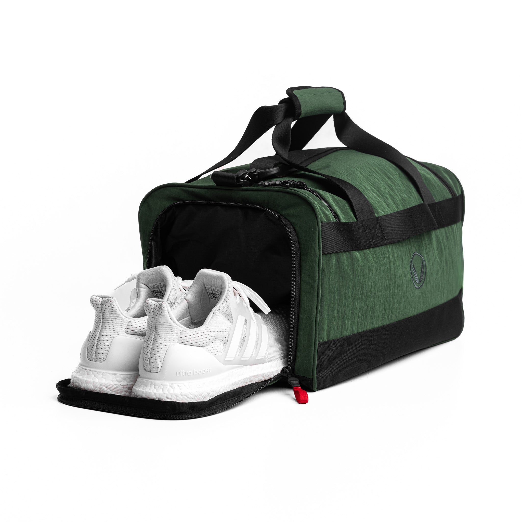 Flatlay 1234 Ripstop Duffle Bag in forest green, front view with shoe compartment open