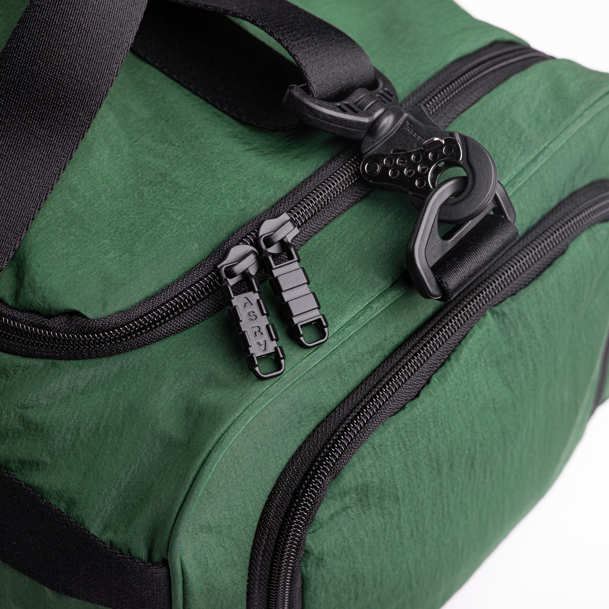 Flatlay 1234 Ripstop Duffle Bag in Forest Green, detail view of zippers and handles