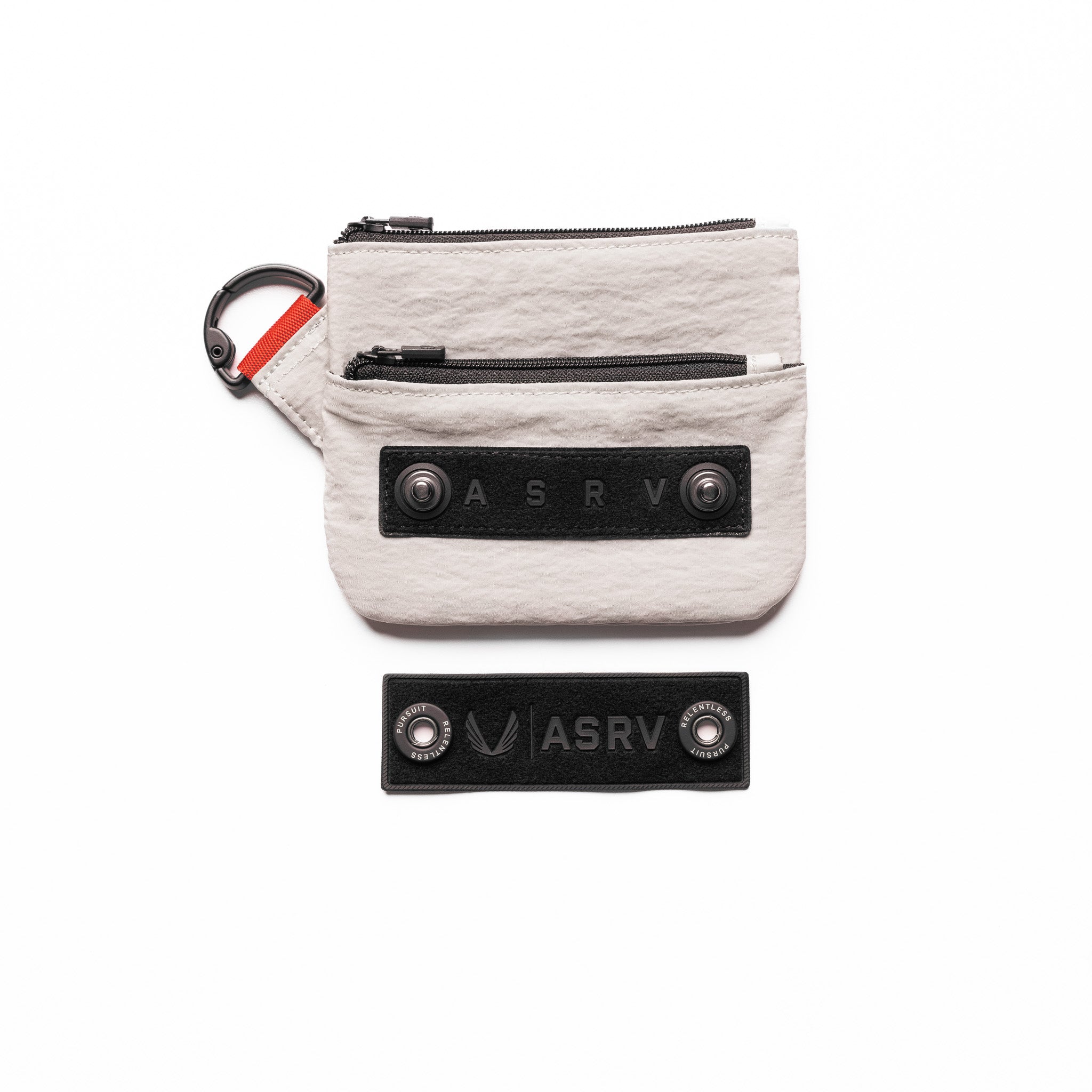 Flatlay of 1235 Ripstop Clip Bag in chai with detachable patches and carabiner