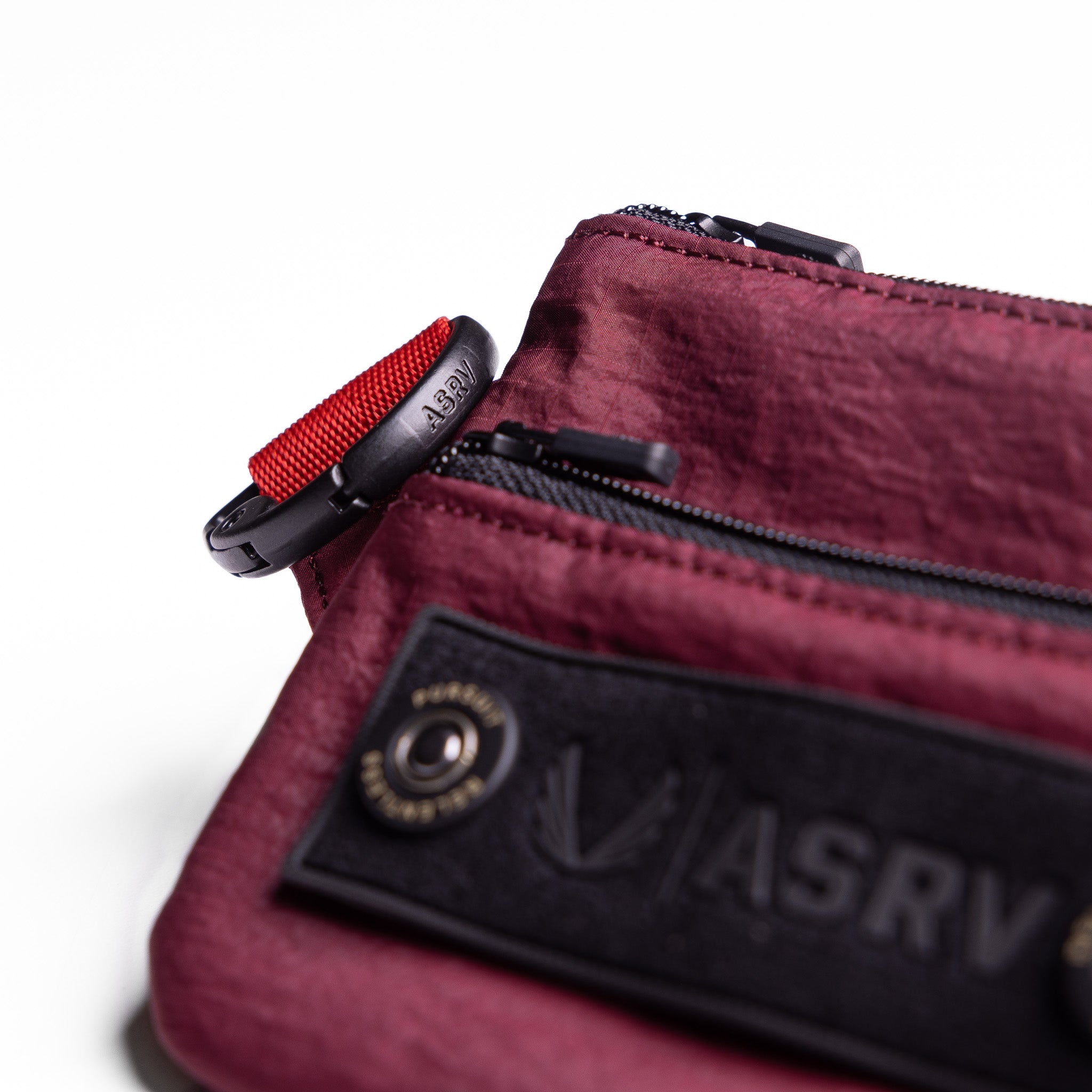 Flatlay 1235 Ripstop Clip Bag in Crimson, detail view with red strap