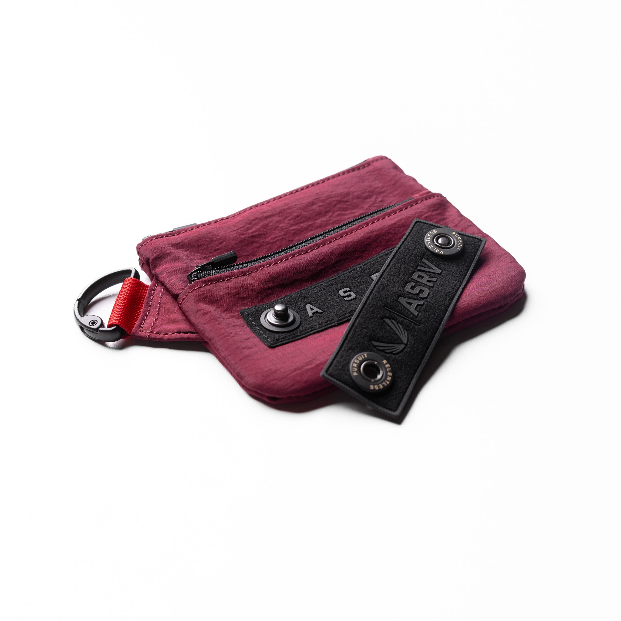 Flatlay 1235 Ripstop Clip Bag in Crimson, front view with black label detail