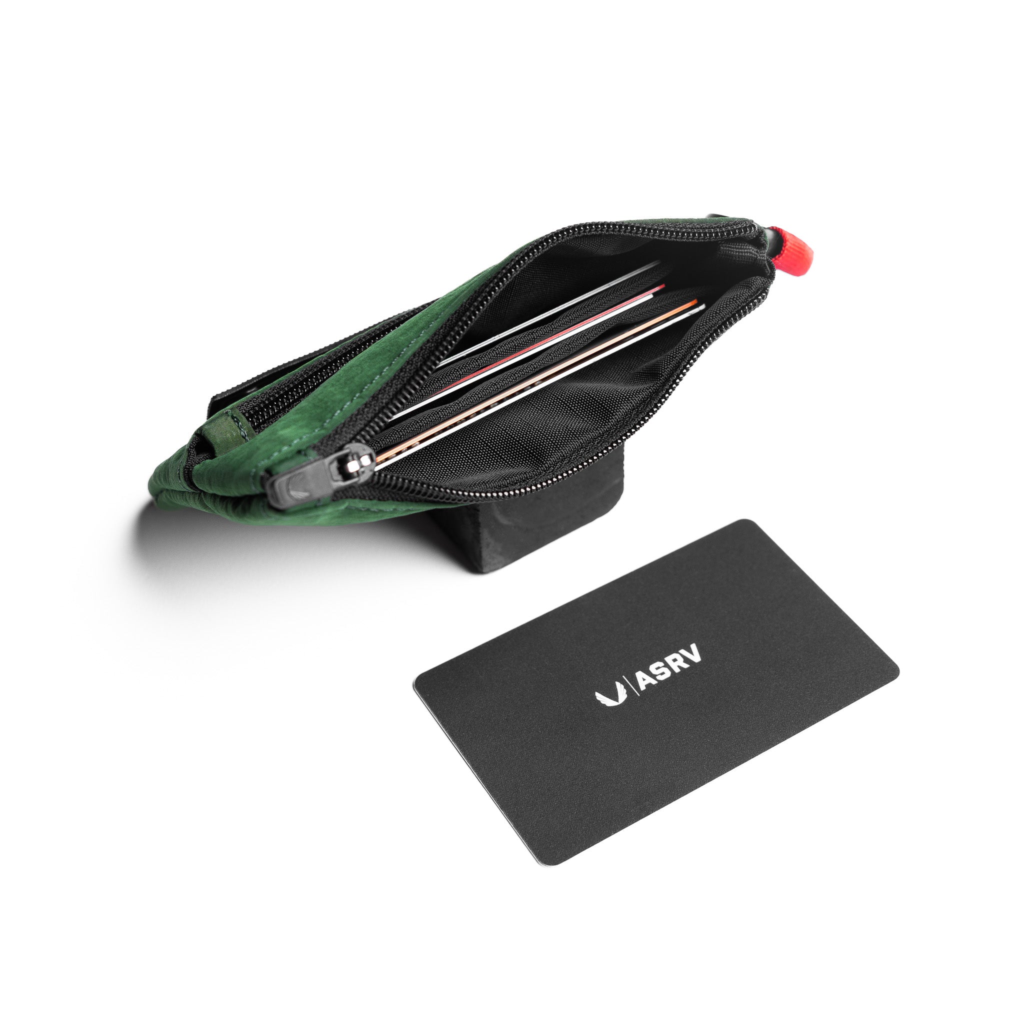 Flatlay 1235 Ripstop Clip Bag in forest green, open view with contents
