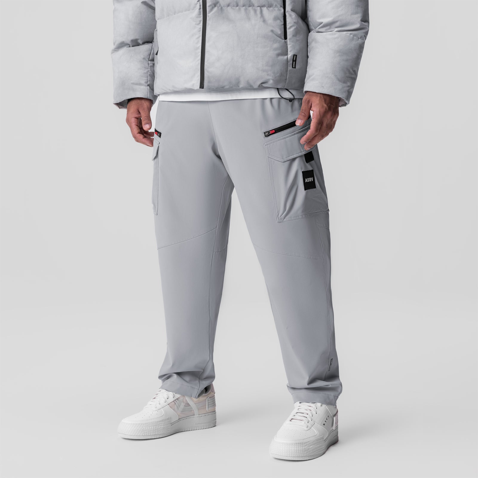 Tetra Weather-Ready City Pant in slate grey worn by model with white sneakers, front view