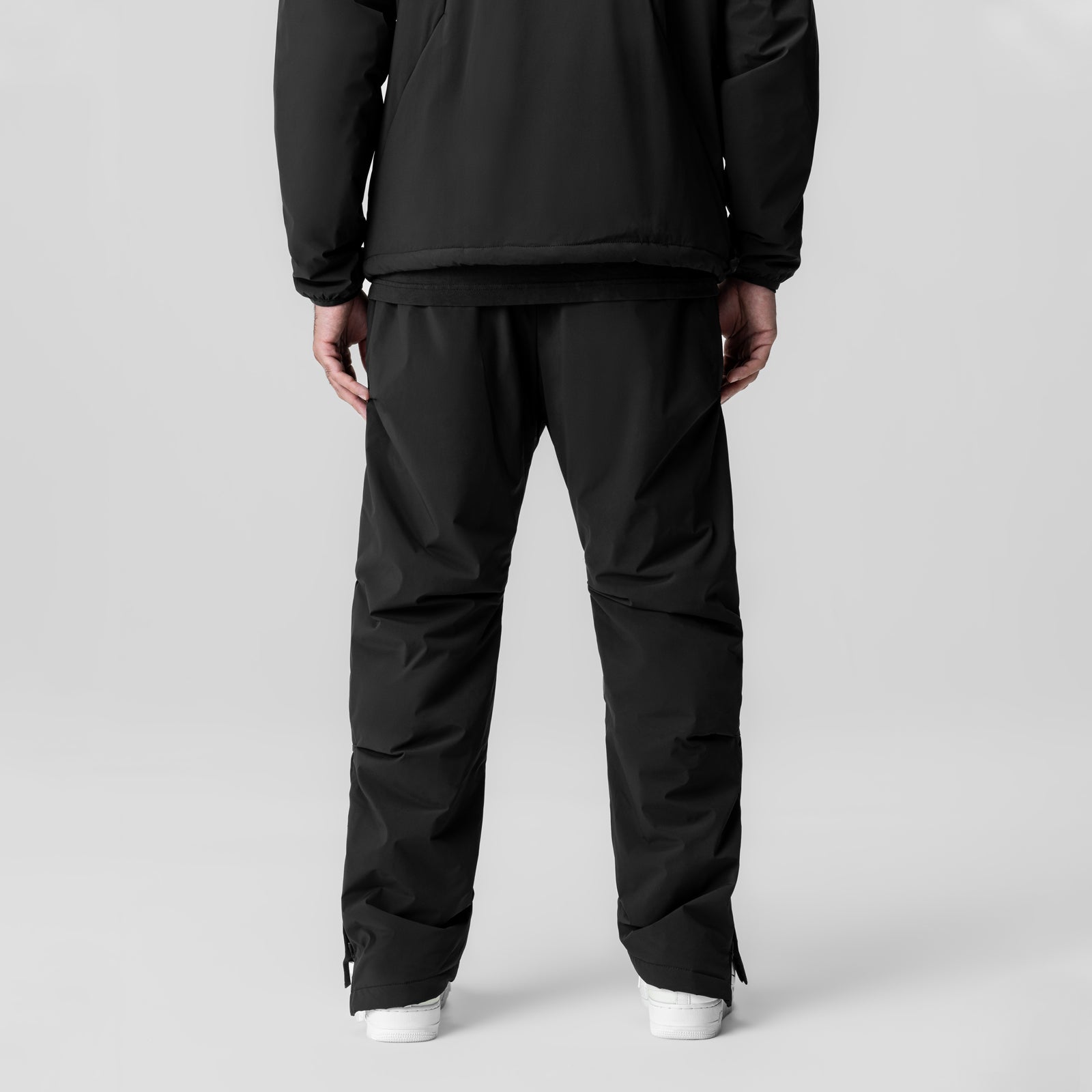 Aerotex™ PrimaLoft® Warm-Up Pant in black, rear view on model