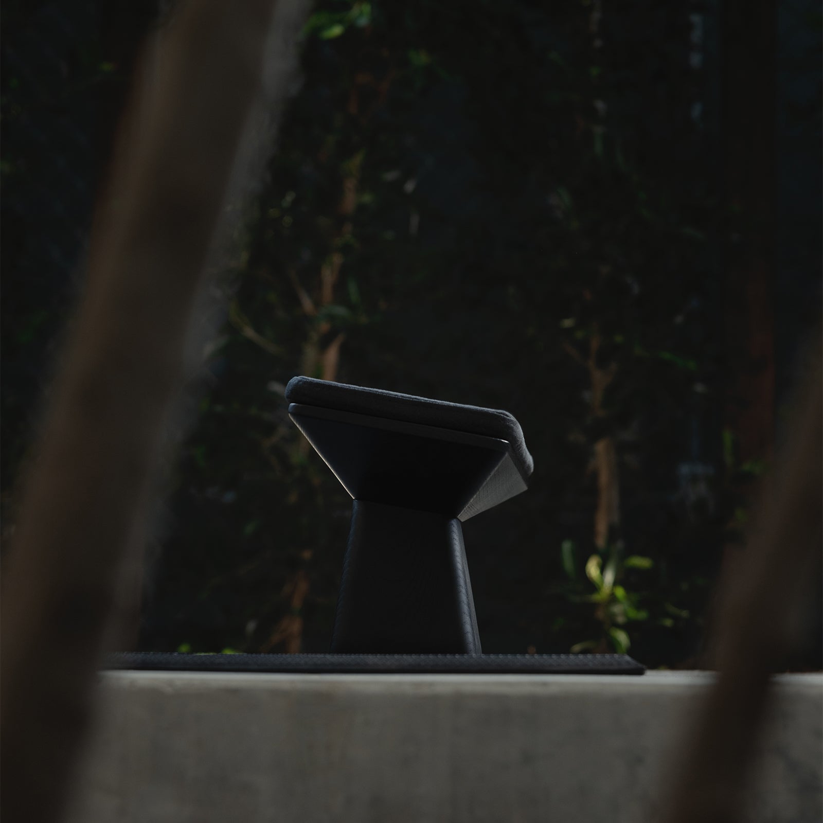 flatlay ASRV x Walden Meditation Bench in black, front view with natural background