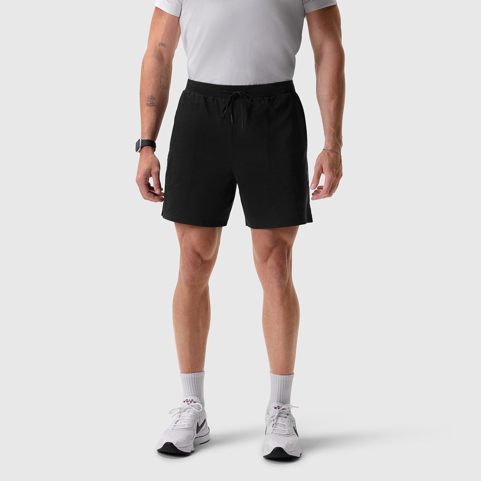 Aerotex™ 6" Training Short in black, worn by model with white tee and white sneakers