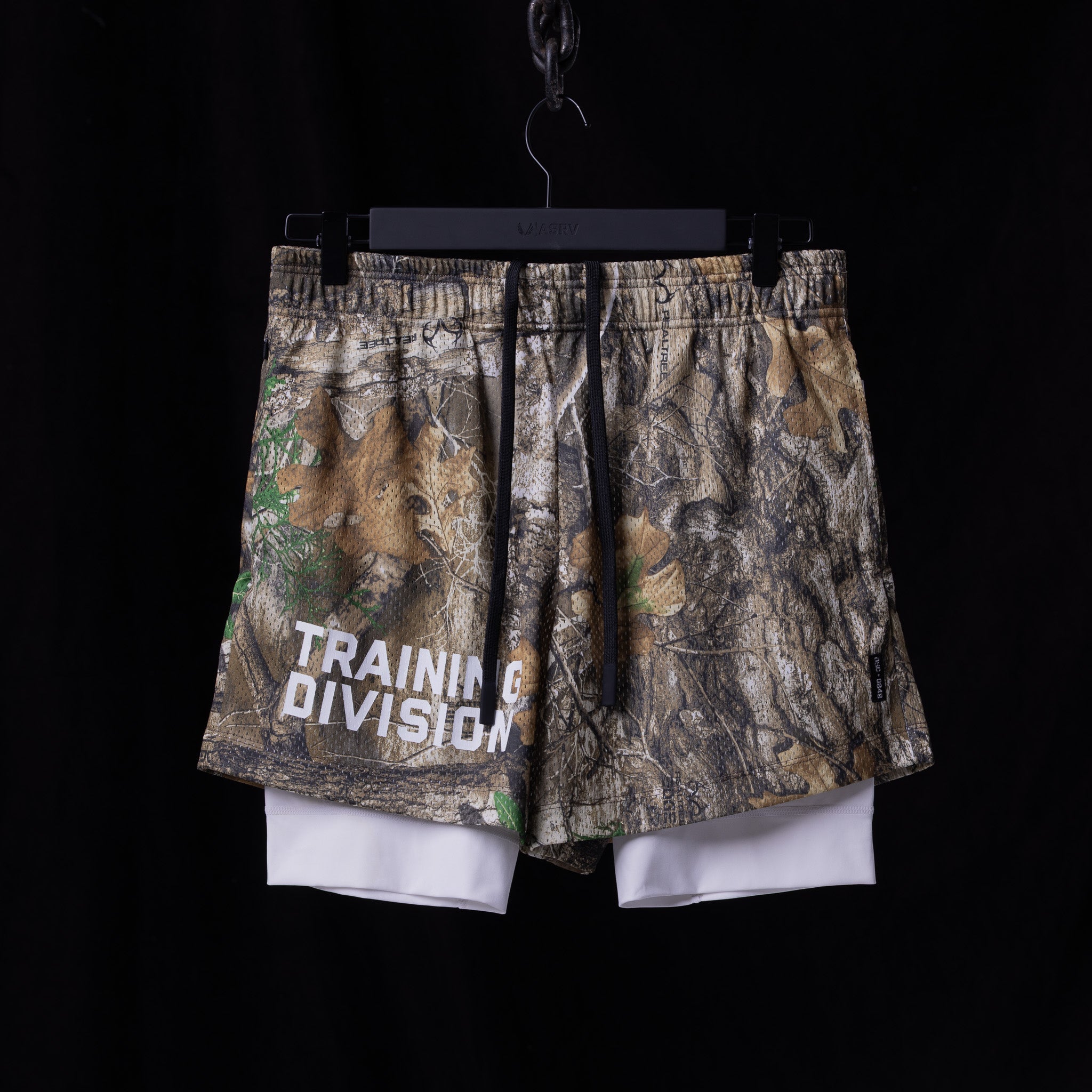 flatlay FA'23 Training Division Mesh Shorts in camo with white underlayer, front view