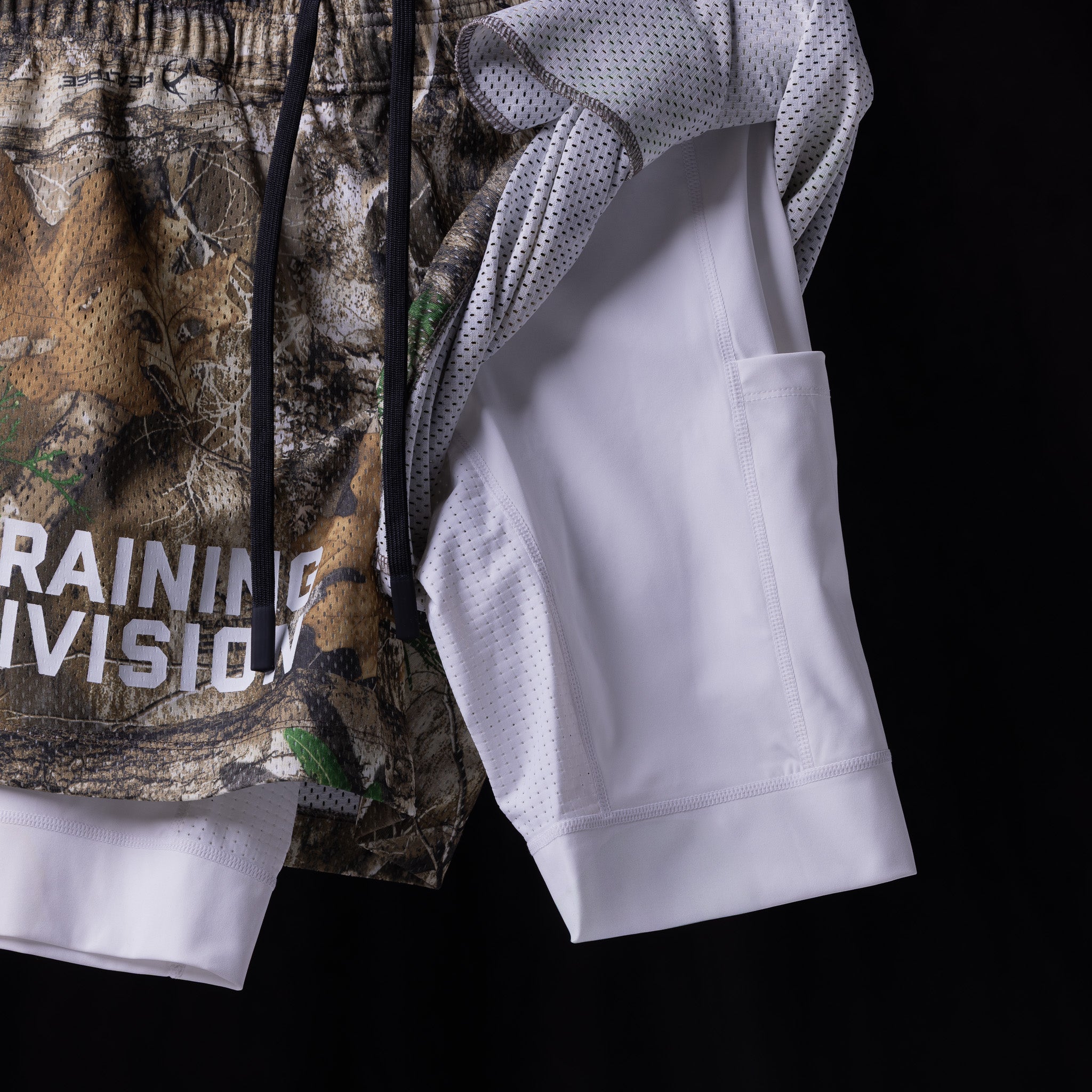Training Division mesh shorts in white and camo, layered display shot