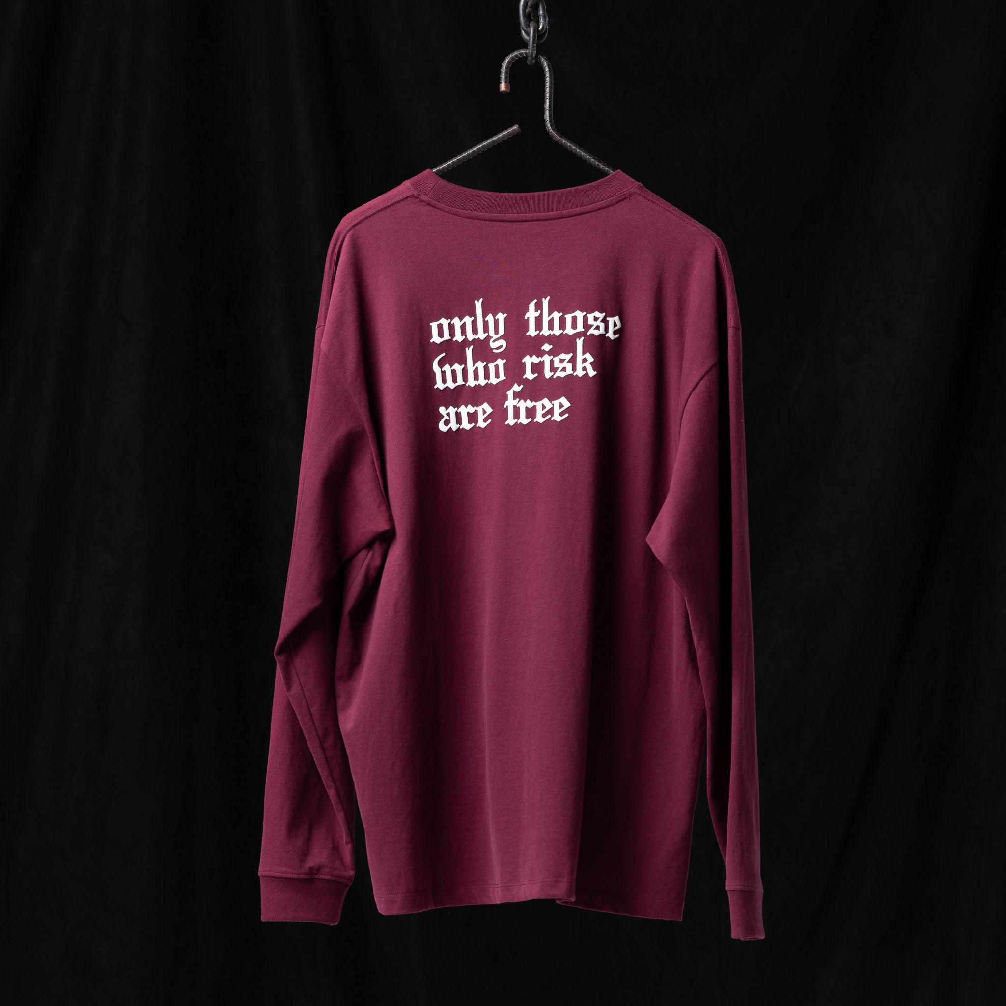 SM'22 Graphic Long Sleeve in burgundy displayed on hanger, back view showing white text