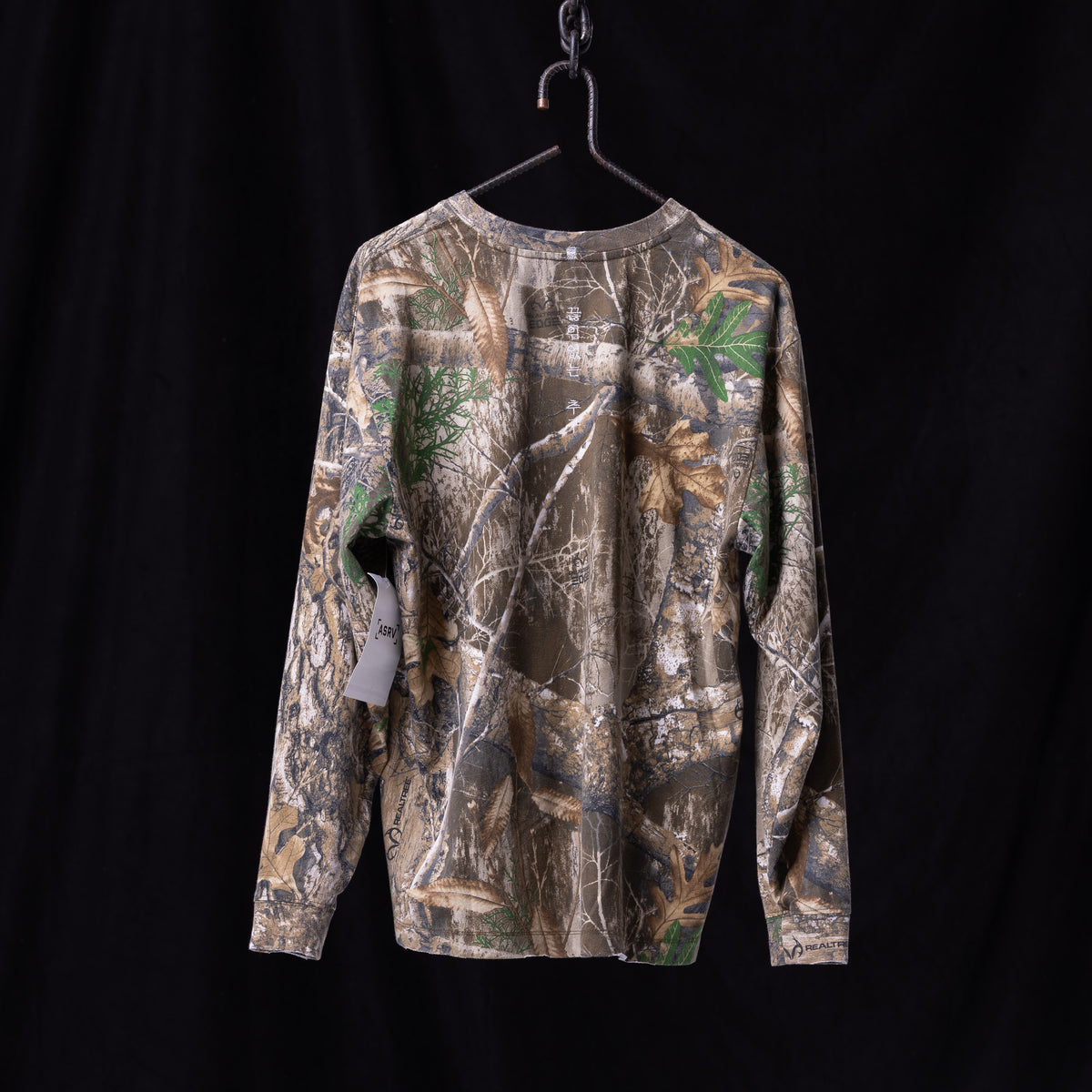 FA'23 Relaxed Long Sleeve in realtree camo print, front view, on hanger