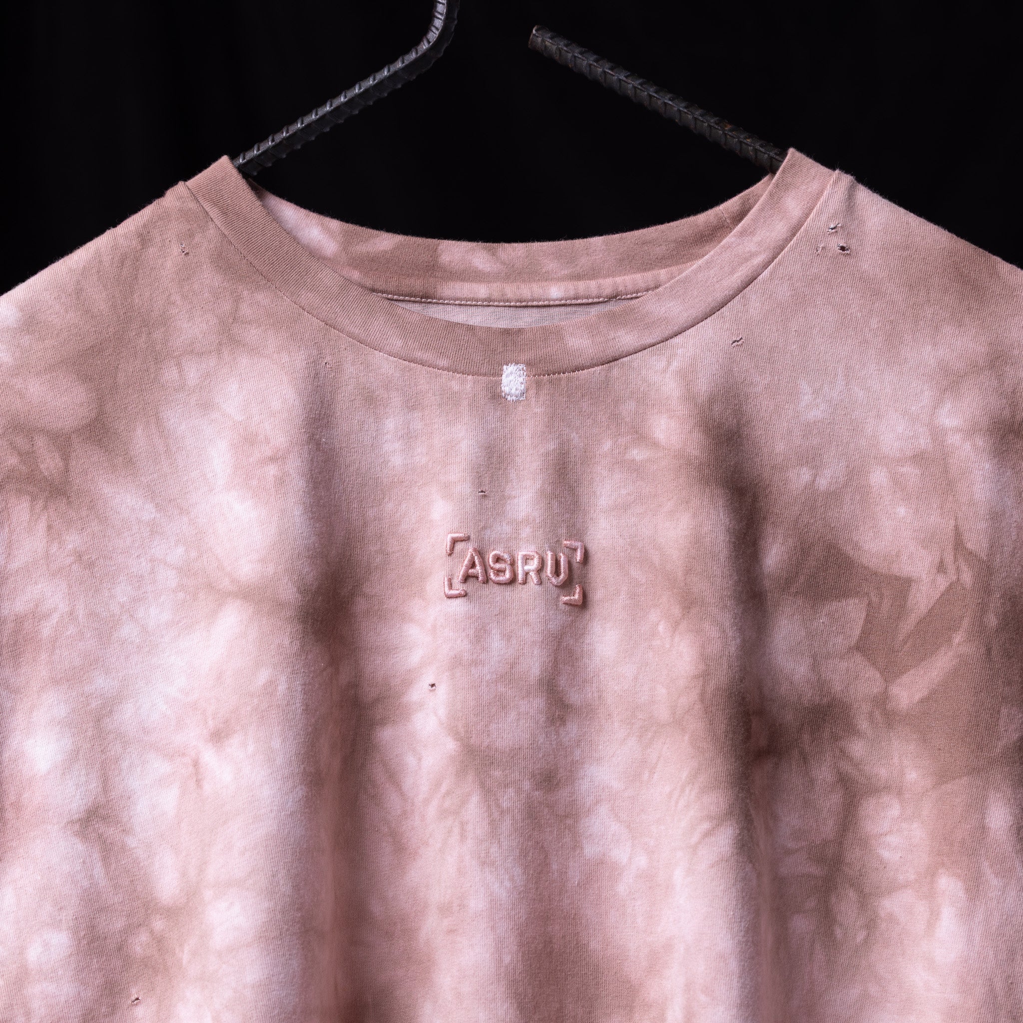 ASRV 2020 Tie Dye Cutoff Tank in mauve pink, displayed on hanger