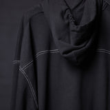 FA'20 Contrast Thread Hoodie in black with white contrast stitching, worn on model