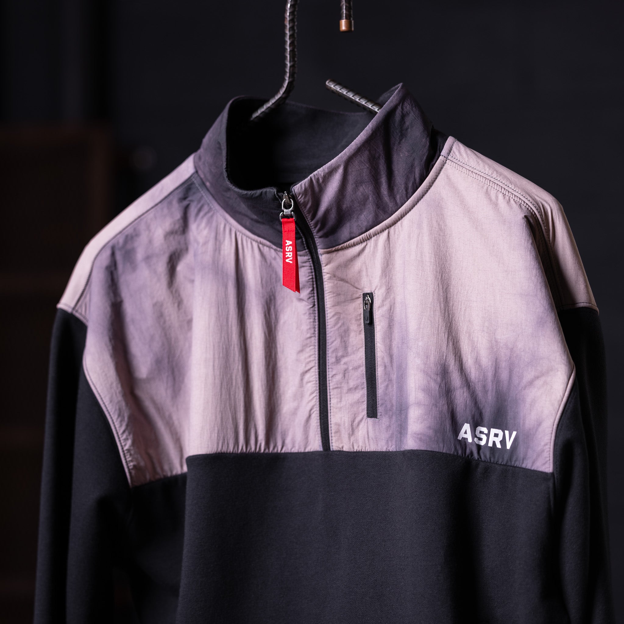 WN'23 Panel Quarter Zip Jacket in lavender and black on hanger, front view