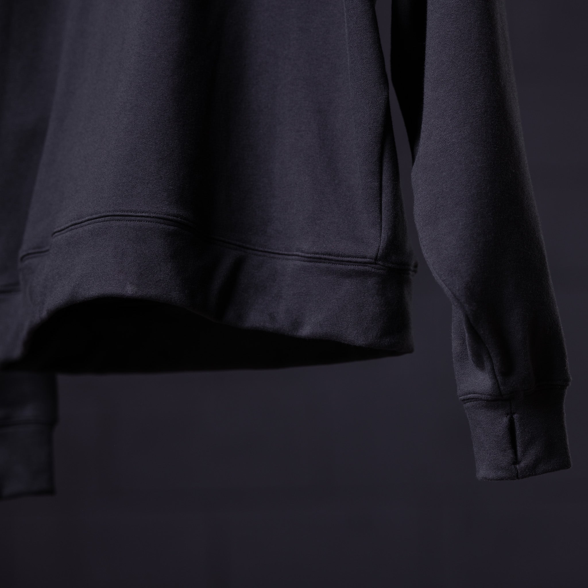 WN'23 Panel Quarter Zip Jacket in black, detail shot of sleeve and torso
