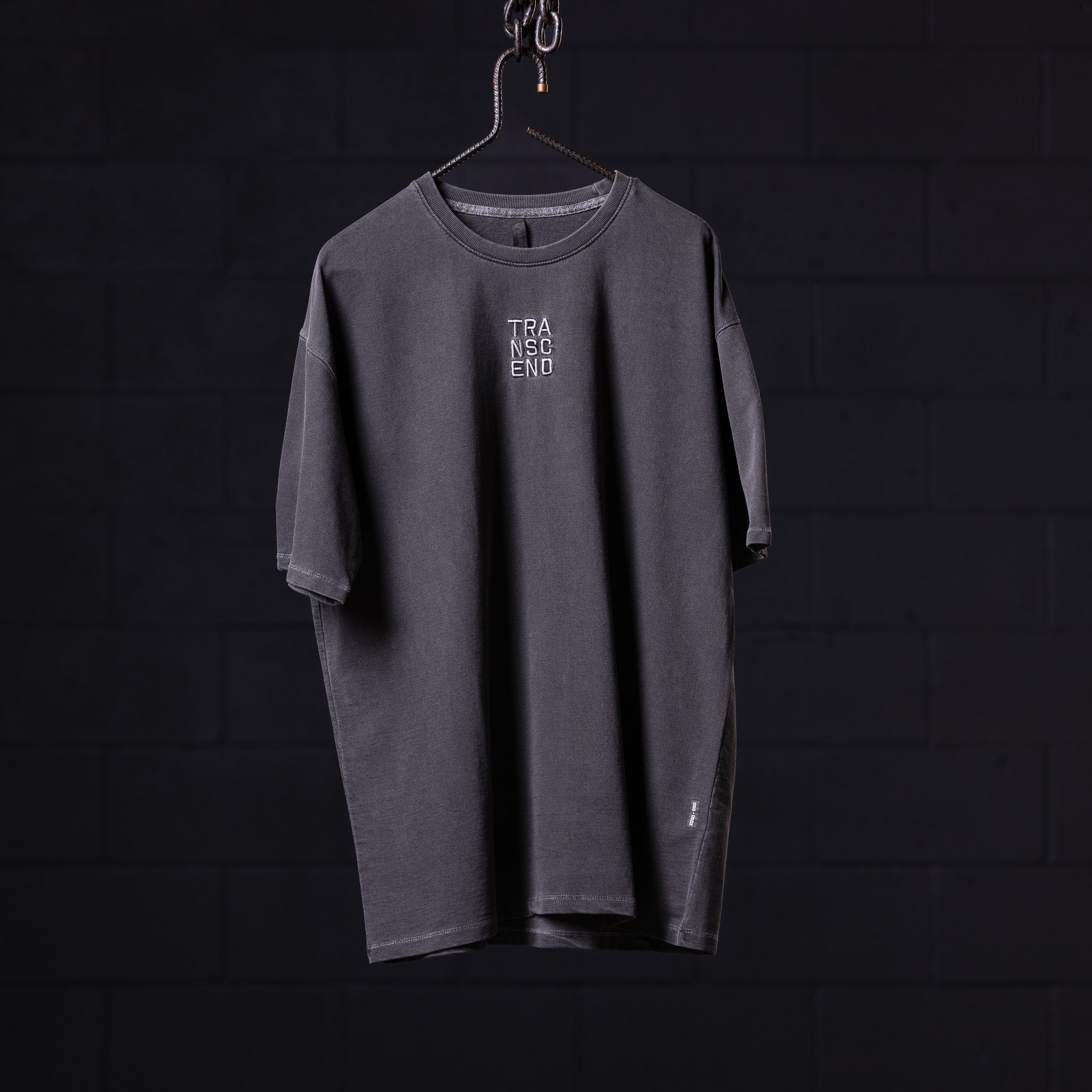 SP'22 Stone Washed Oversized Tee in charcoal gray displayed on hanger