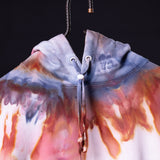 SM'22 Tie Dye Hoodie in blue and coral gradient, front view on model
