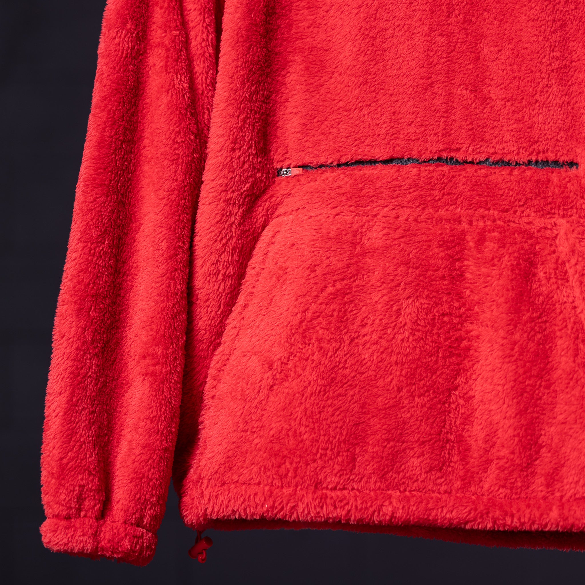 WN '23 Sherpa Recovery Hoodie in red, detail shot of fabric texture and zipper