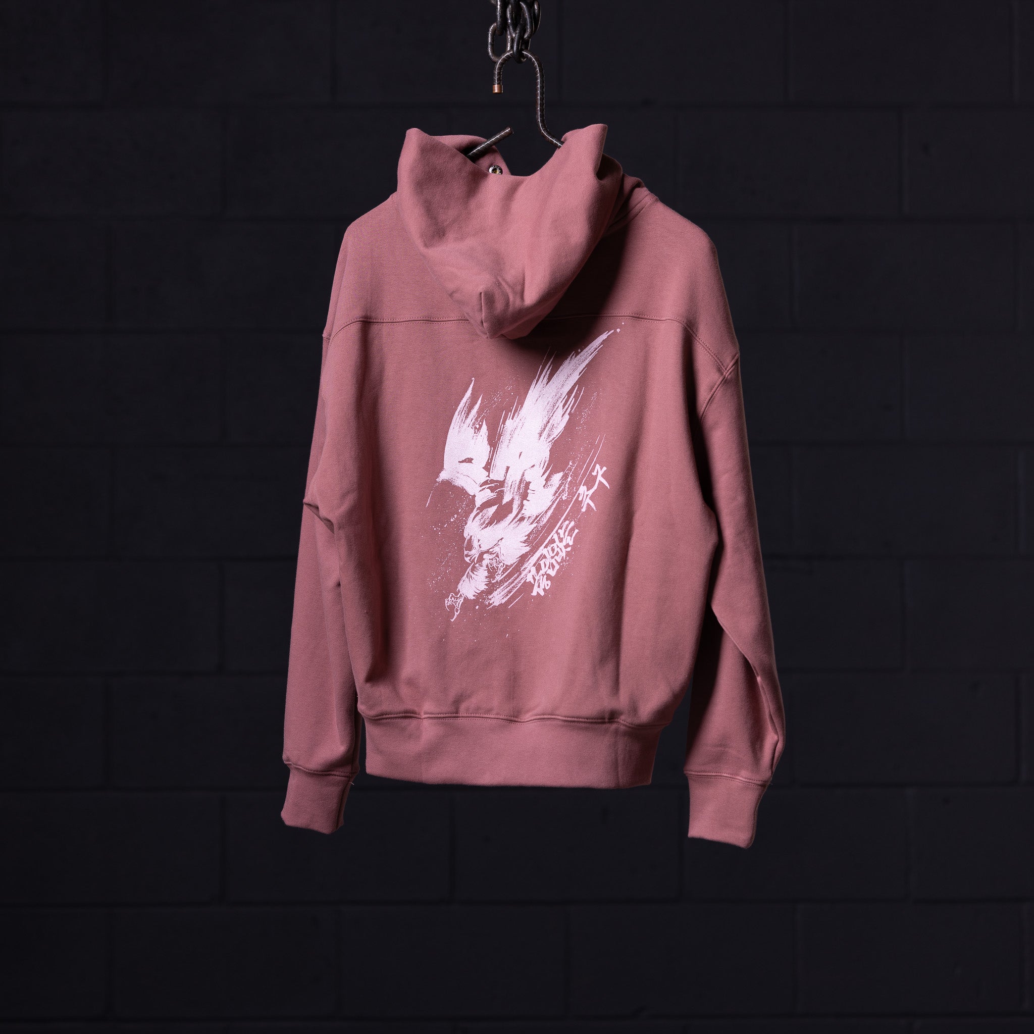 FA'22 Tech Terry Eagle Hoodie in mauve pink, hung on display with white graphic print visible
