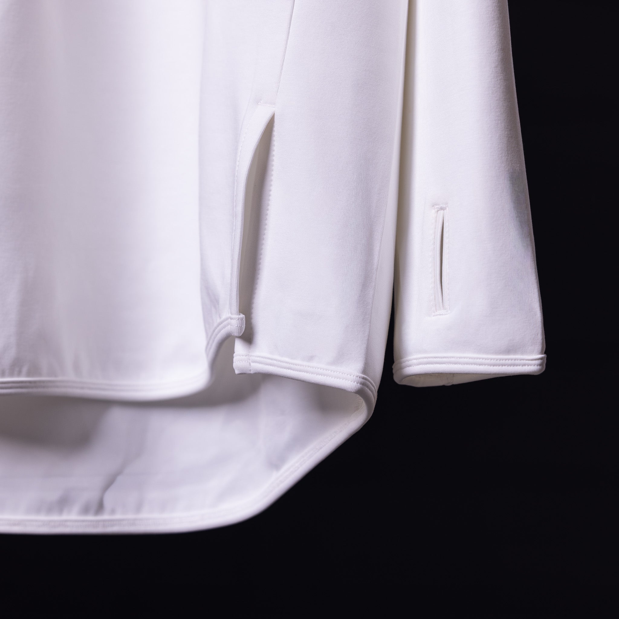 2019 Scuba Hoodie in white, detail shot of sleeve cuff and pocket