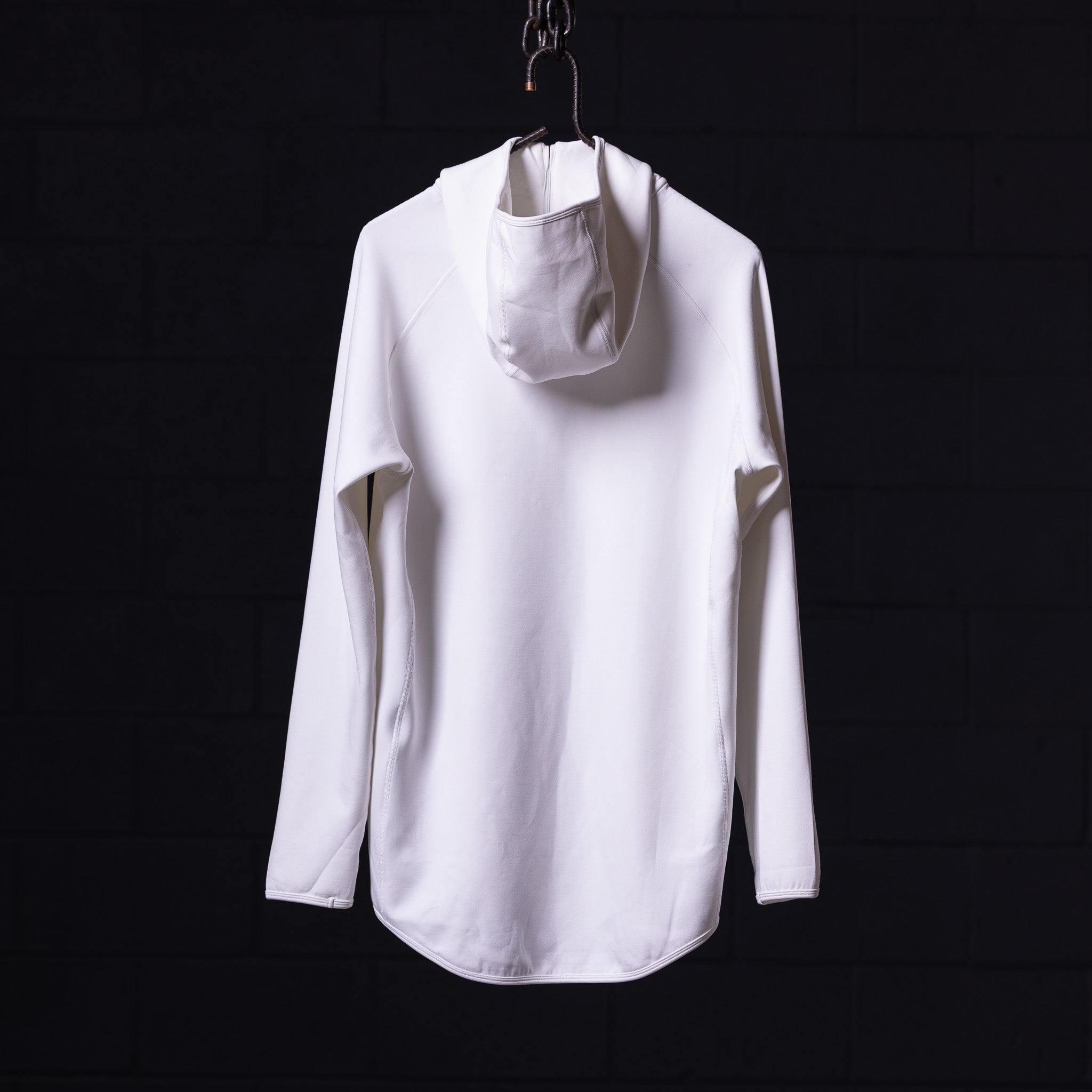 White scuba hoodie displayed on hanger against black background, front view
