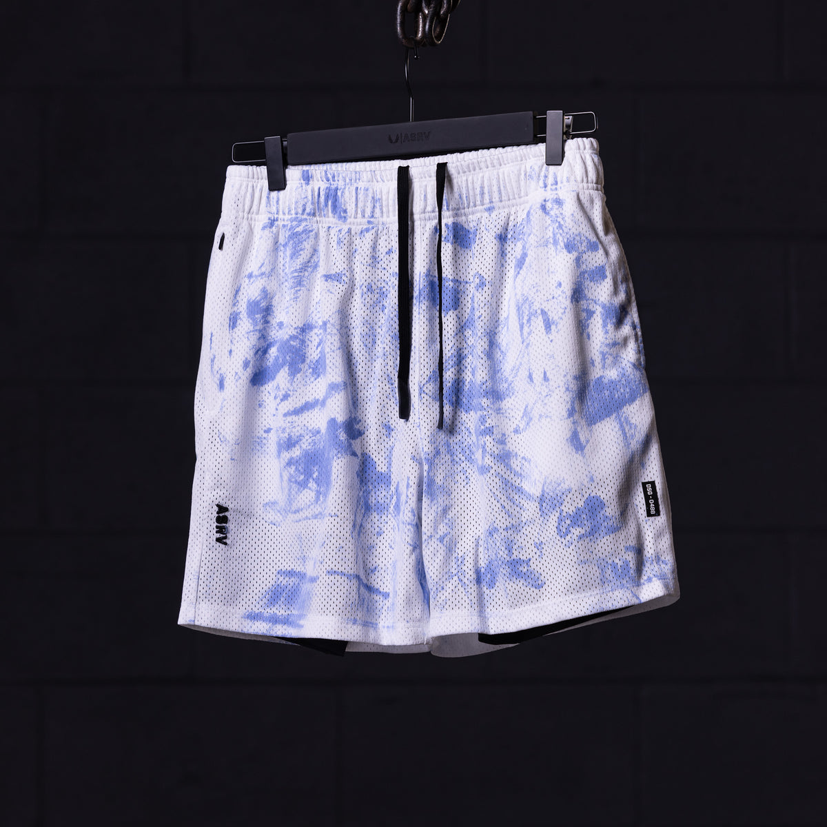 SM'21 Tie Dye Mesh Liner Short in white and blue, front view, on hanger