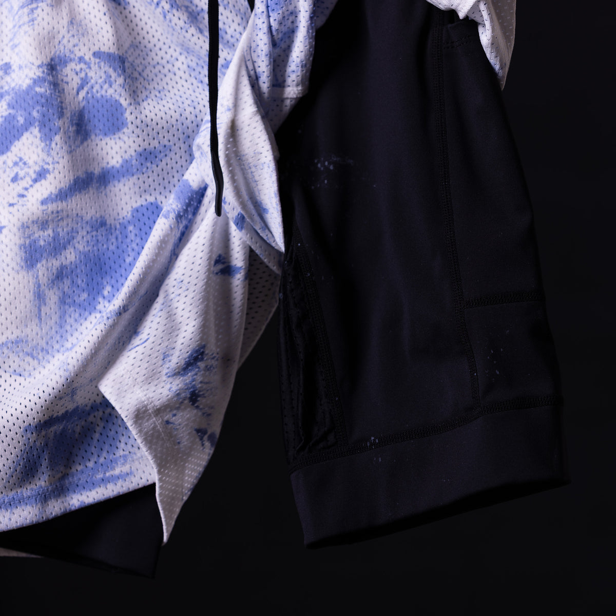 Tie dye mesh liner short in blue and white, detail shot of fabric texture and construction