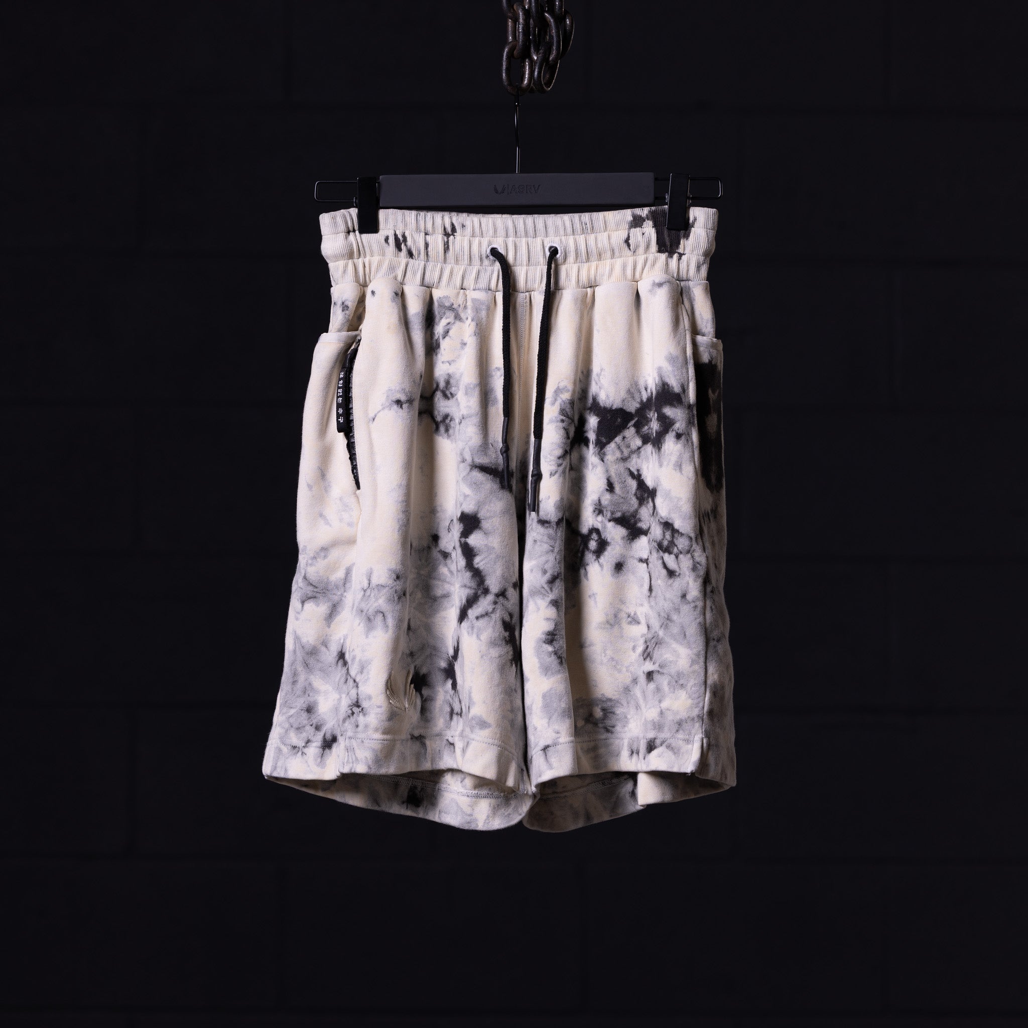 tie dye sweat shorts in cream and black, front view