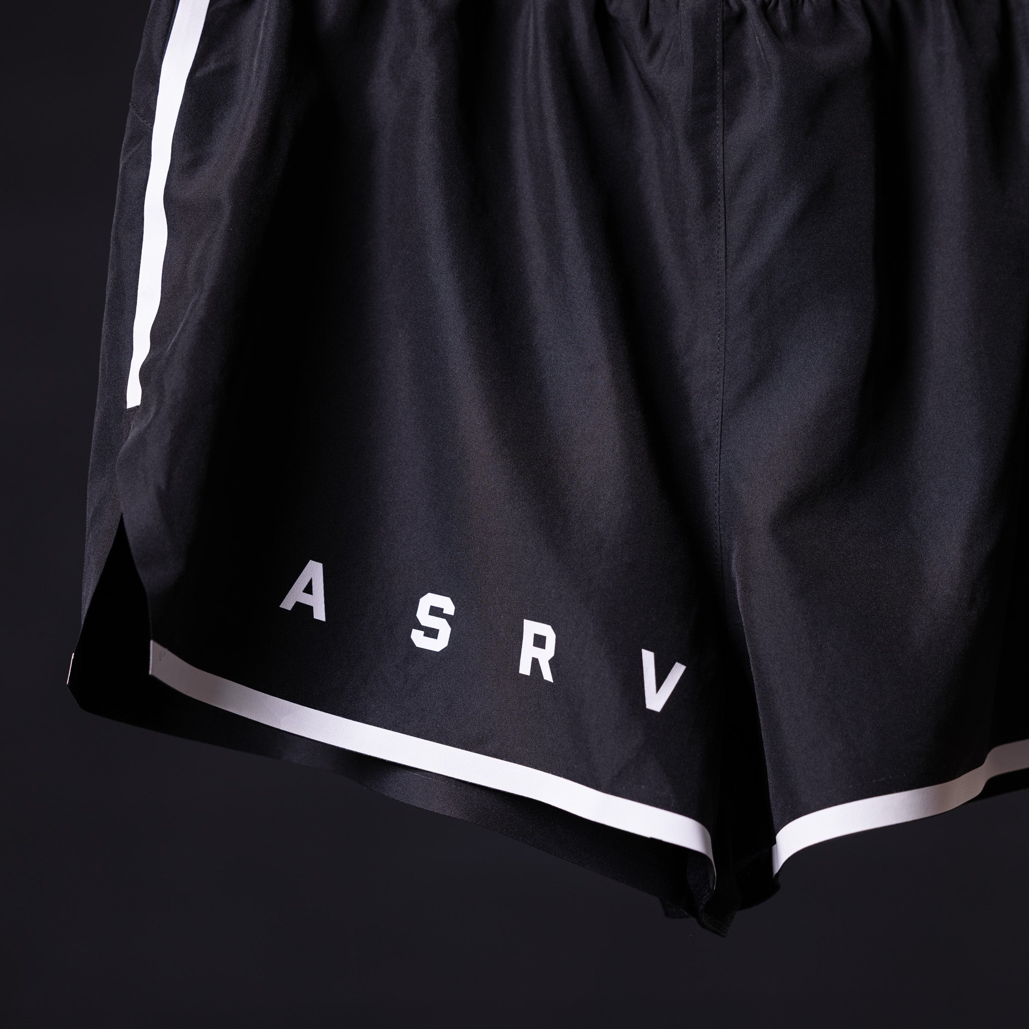 ASRV Reflective 3" Run Short in black with white reflective trim, detail shot of waistband