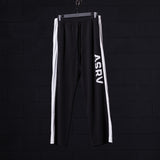 Flatlay of SM'24 Waffle Knit Sweat Pant in black with white side stripes, front view