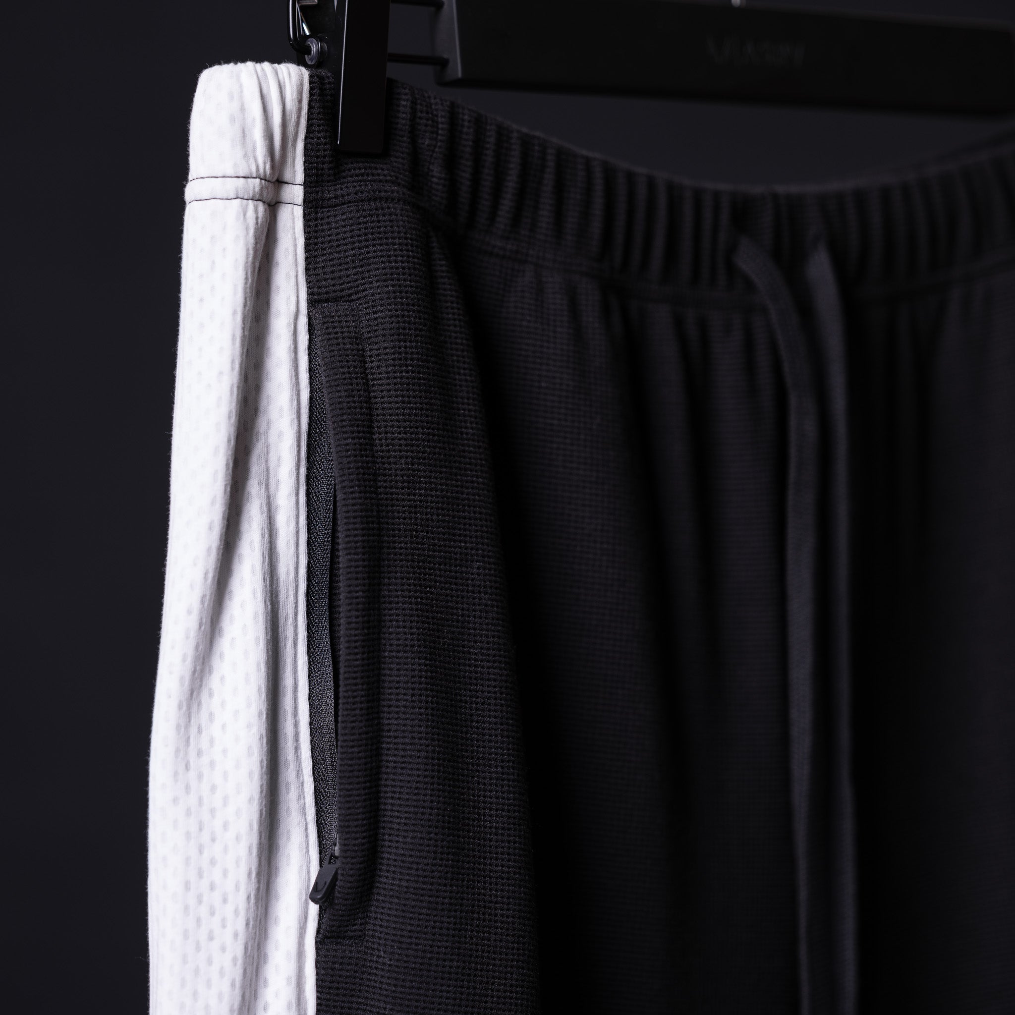 SM'24 Waffle Knit Sweat Pant in black, detail shot of fabric texture and waistband