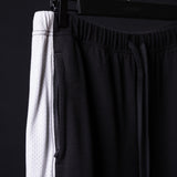SM'24 Waffle Knit Sweat Pant in black, detail shot of fabric texture and waistband