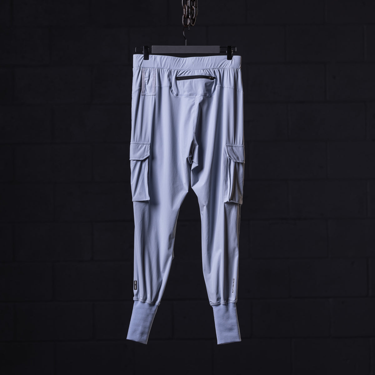 WN'22 Cargo High Rib Jogger in light blue with cargo pockets, front view, on hanger