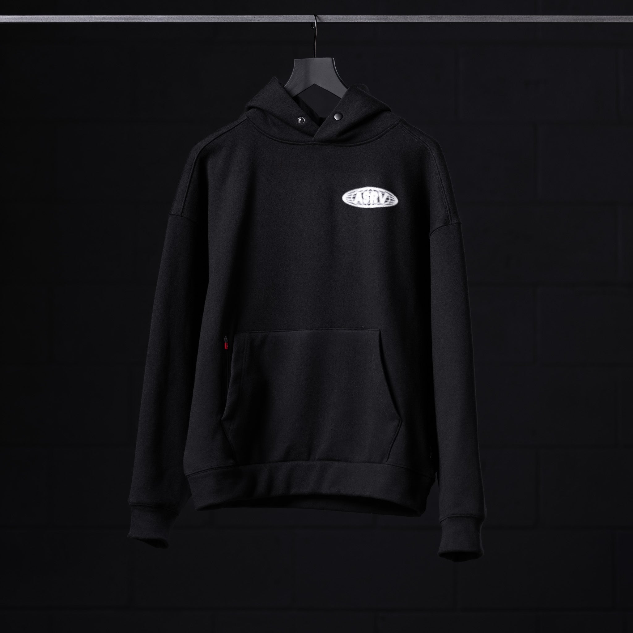 Flatlay Tech-Terry Zip Pocket Hoodie in black with Global Reach logo, front view