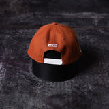 flatlay SM'23 Valley of Fire Low Pro Hat in rust orange and black, back view