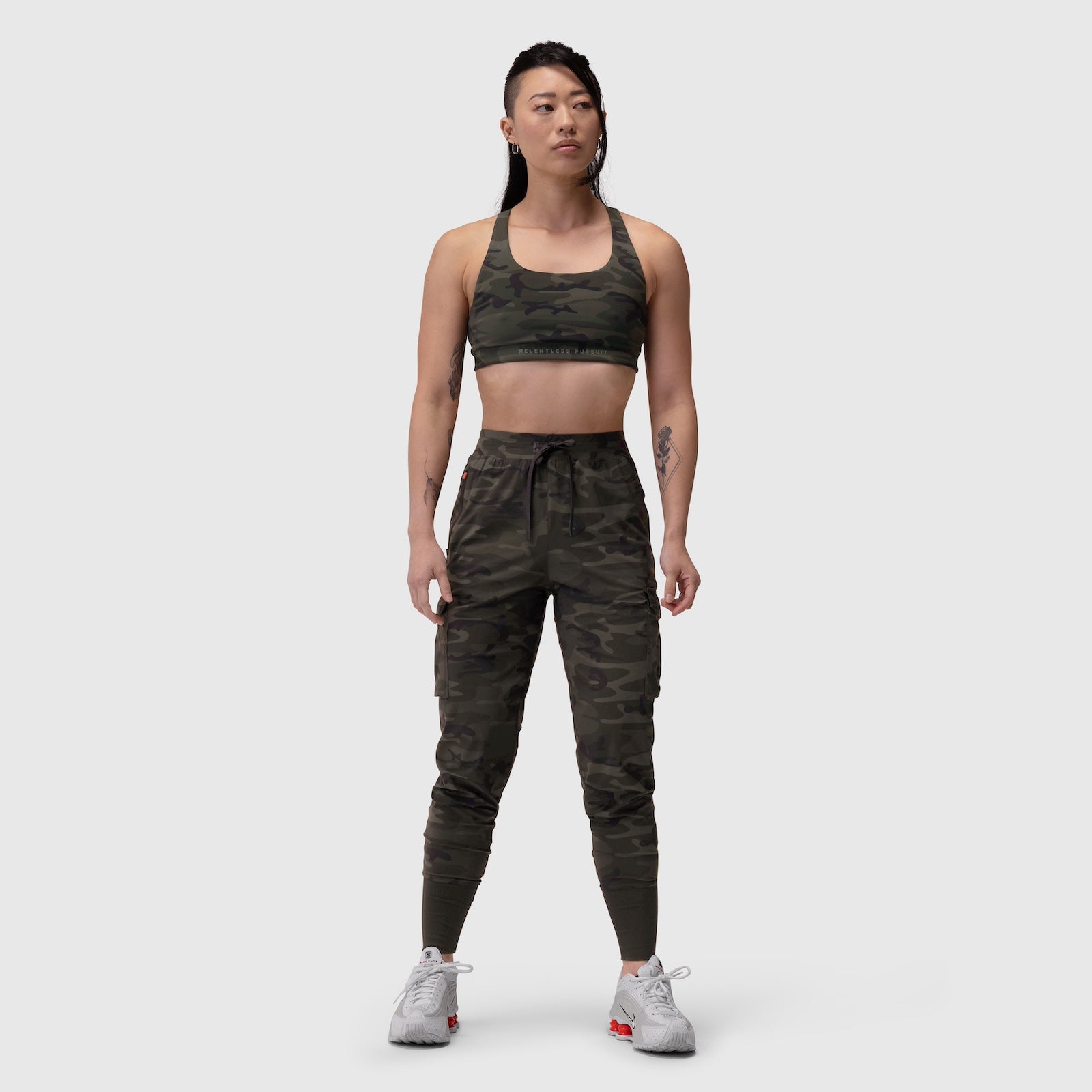 Tetra-Lite Cargo High Rib Jogger in dark camo, worn by model standing against white background