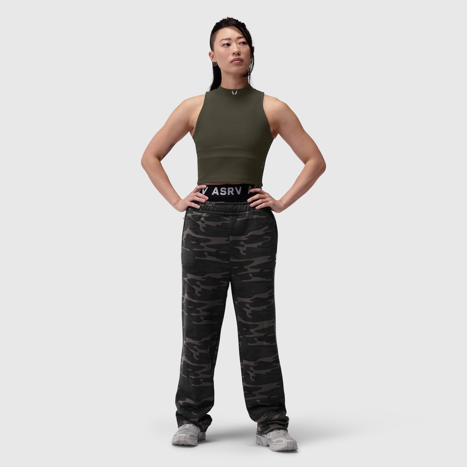 Lycra Ribbed Mockneck Tank in olive worn with camouflage joggers, front pose
