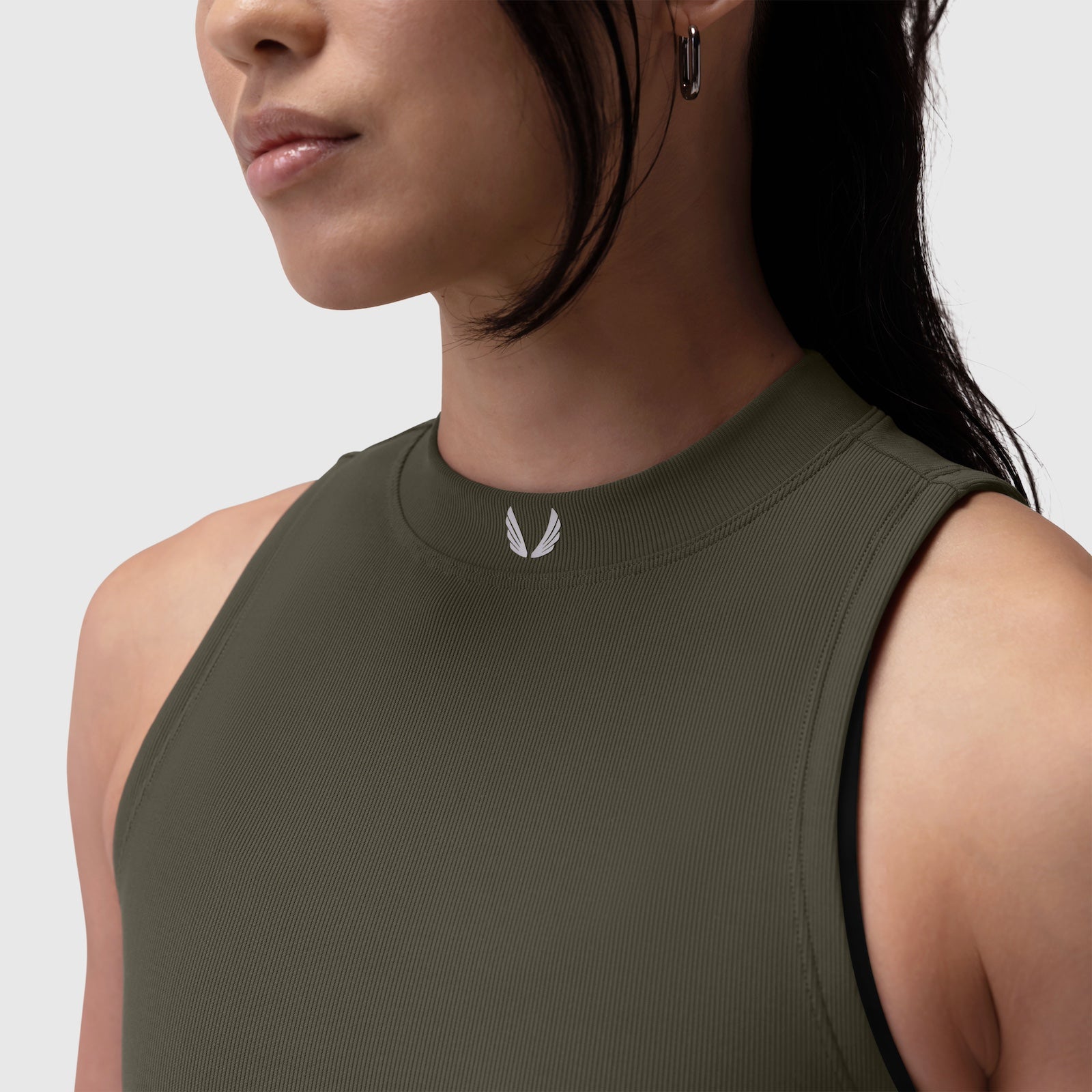 W023 Lycra Ribbed Mockneck Tank in olive, worn by model, side view