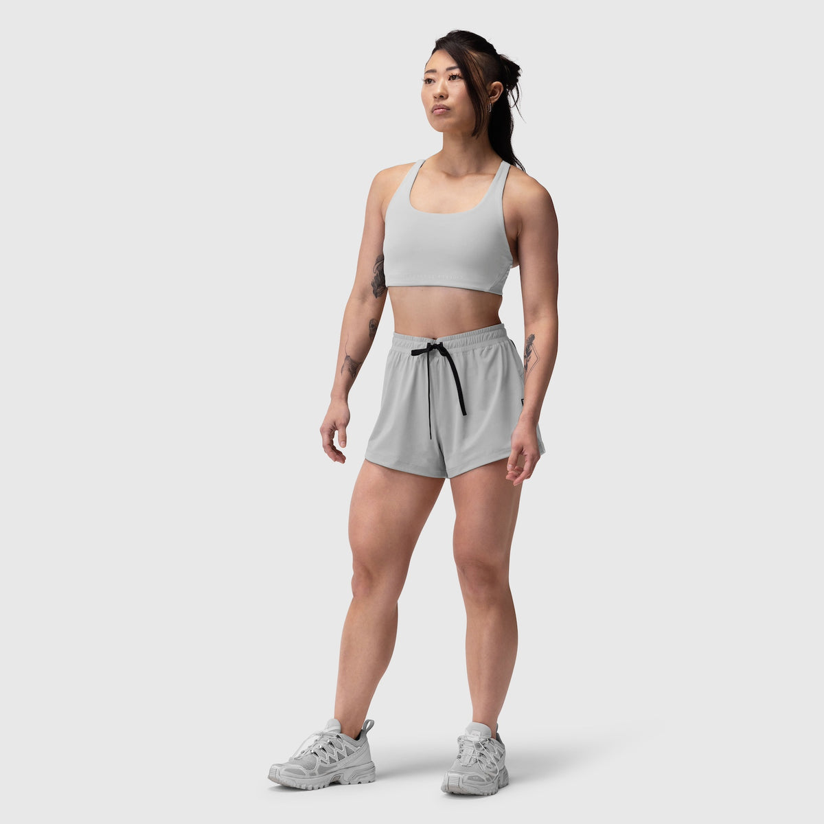 Tetra-Lite Linerless Short in Slate Grey, worn by model standing against white background