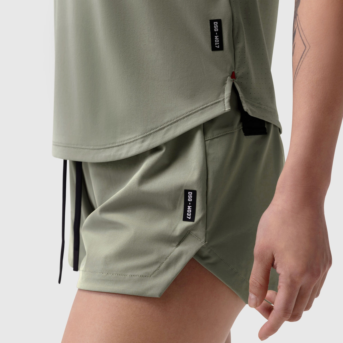 Laser-Vent Established Tee in sage worn with matching shorts, side detail view