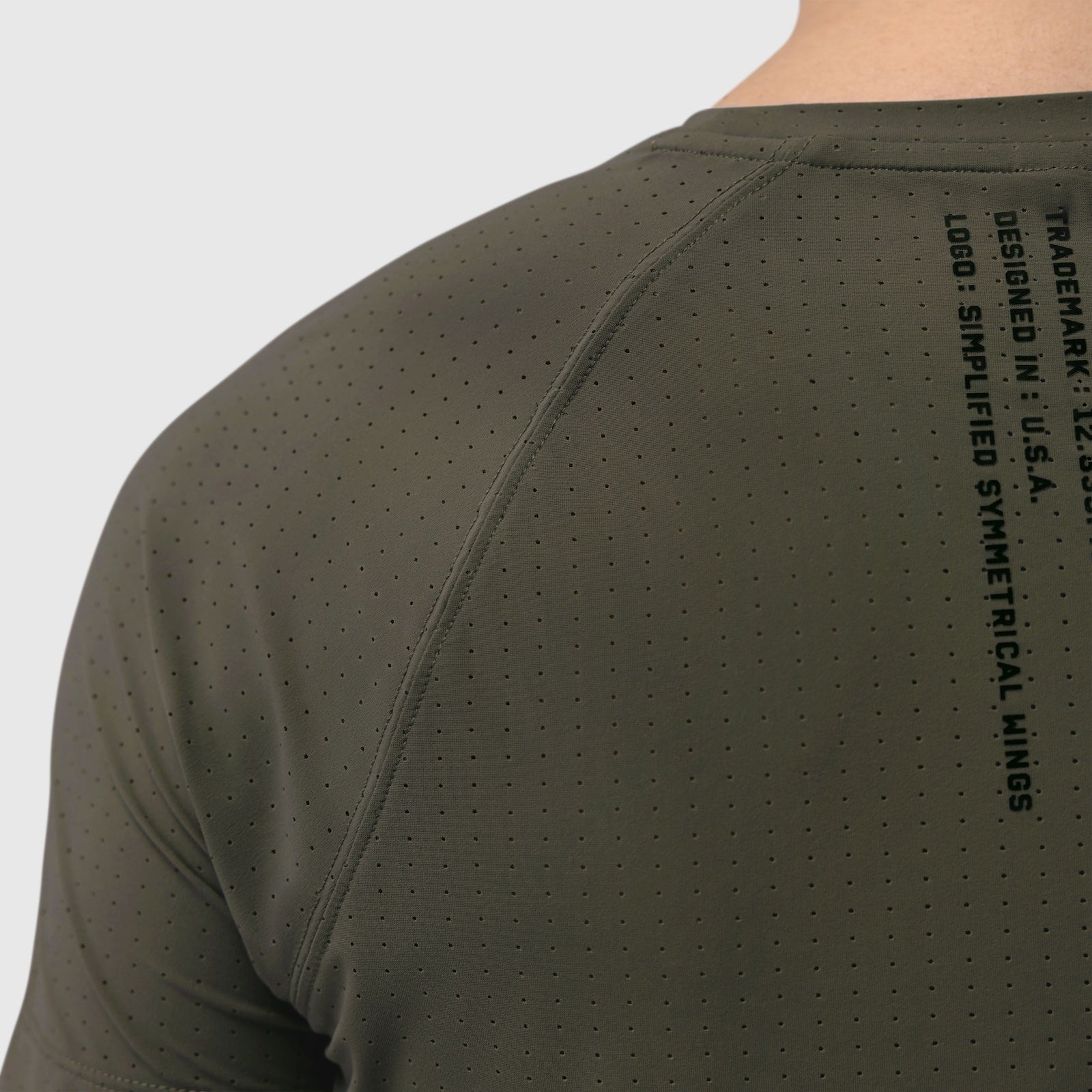 Laser-Vent Established Tee in olive worn by model, back view showing perforated fabric detail