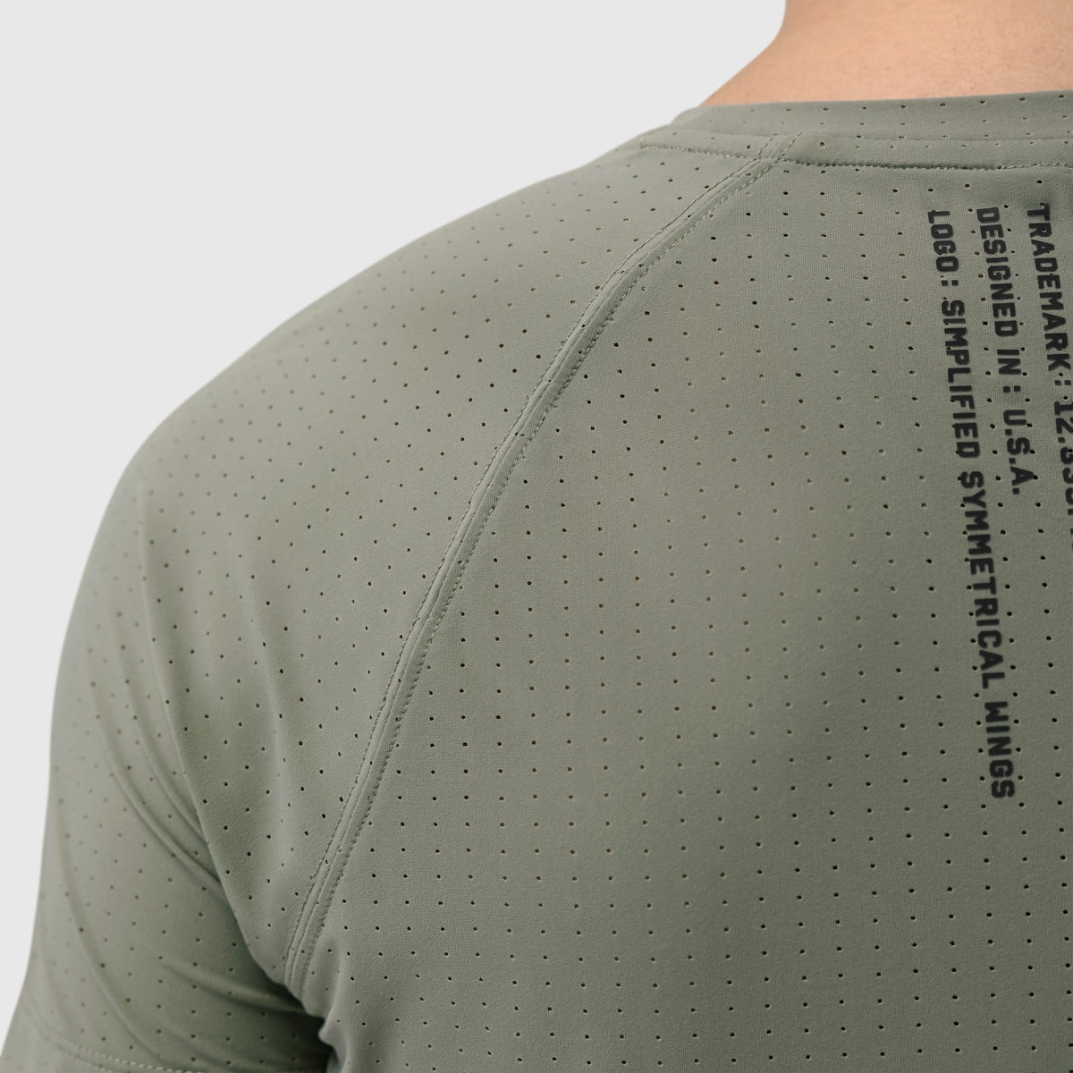 Laser-Vent Established Tee in sage worn by model, back detail view