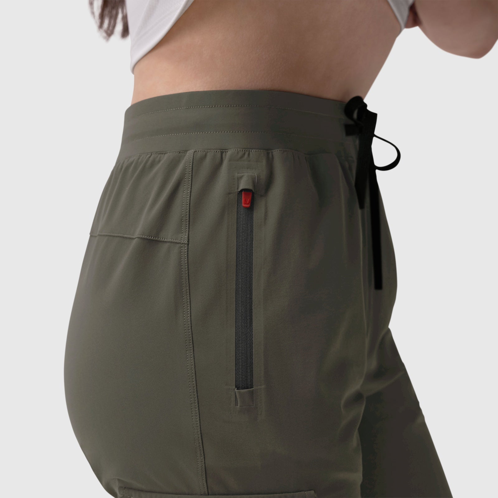 Tetra-Lite Cargo High Rib Jogger in olive worn by model, side view detail
