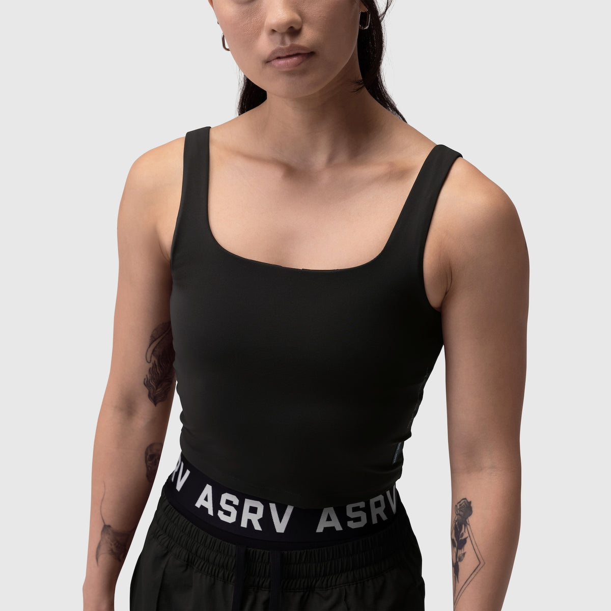 Black LYCRA® 2-in-1 tank top worn by model, front view