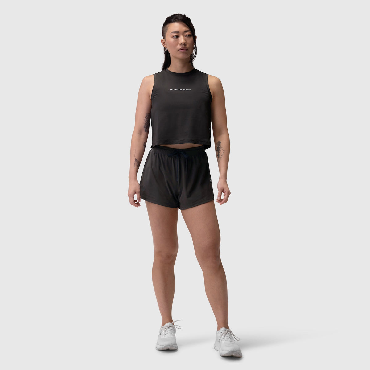 W020 AeroSilver Tank Top in black with RP text, worn with black shorts and white sneakers