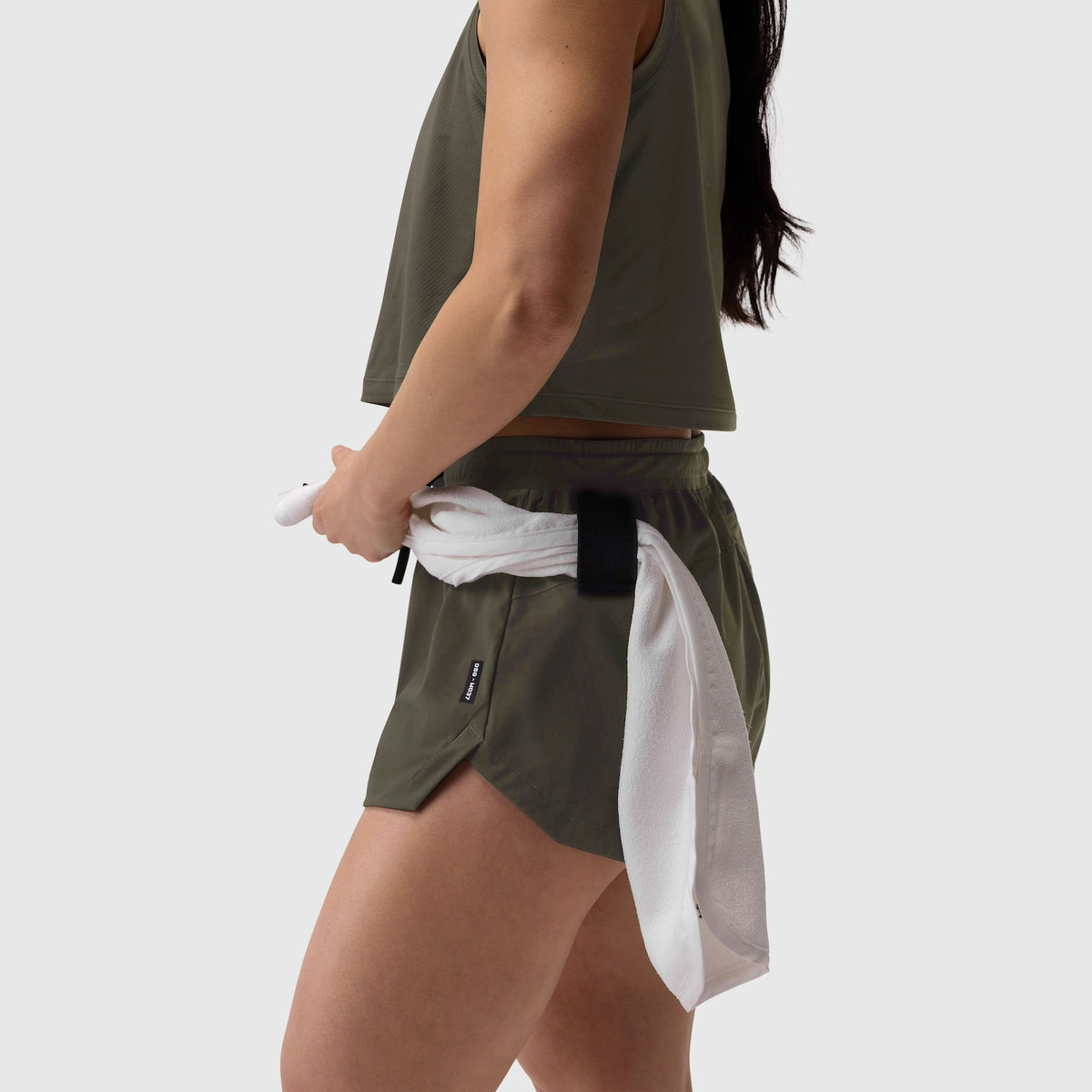 Tetra-Lite Linerless Short in olive, modeled on person with white towel detail